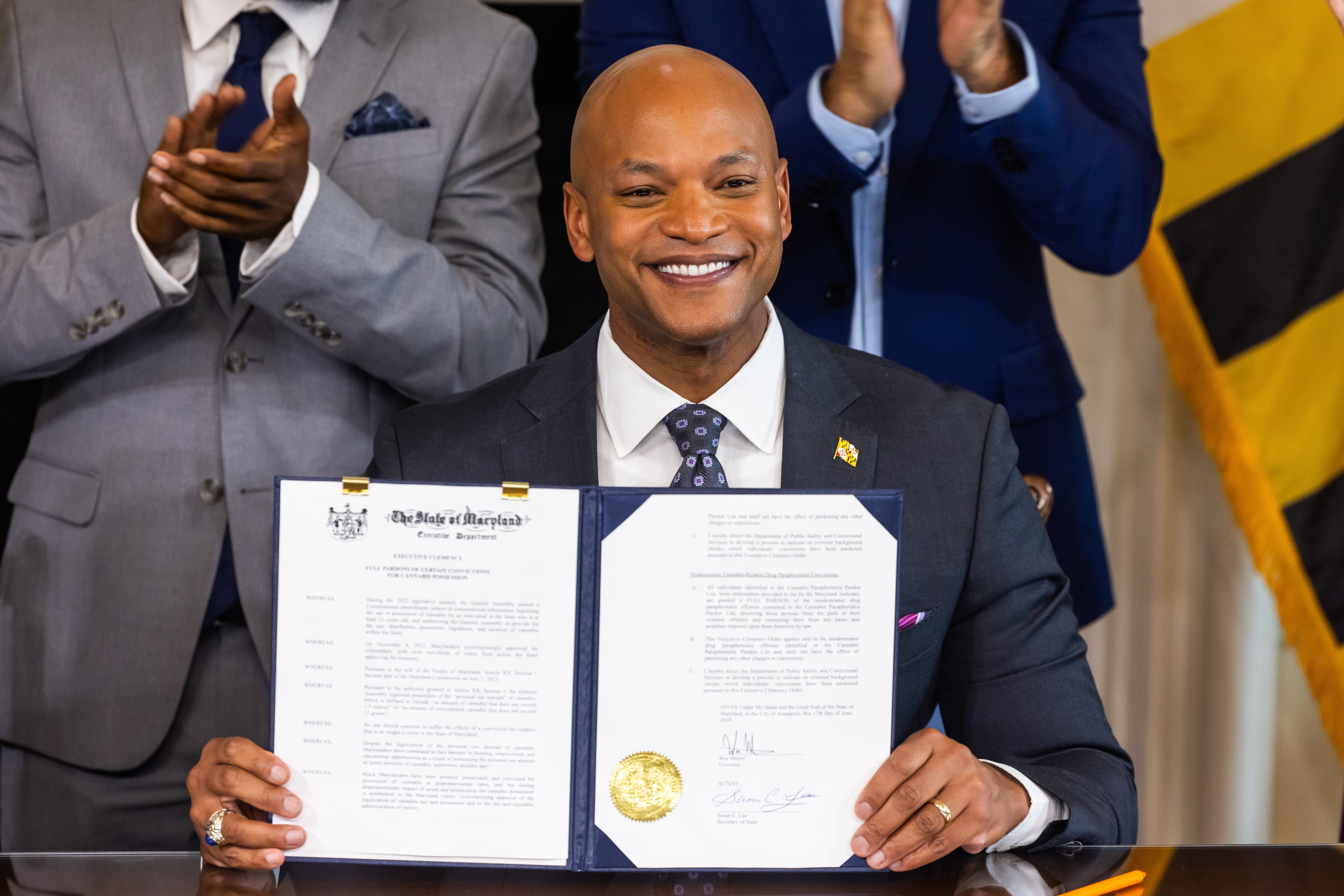 Maryland Governor Wes Moore holds an executive order pardoning 175,000 cannabis-related convictions at the Maryland State House in Annapolis, Maryland on June 17