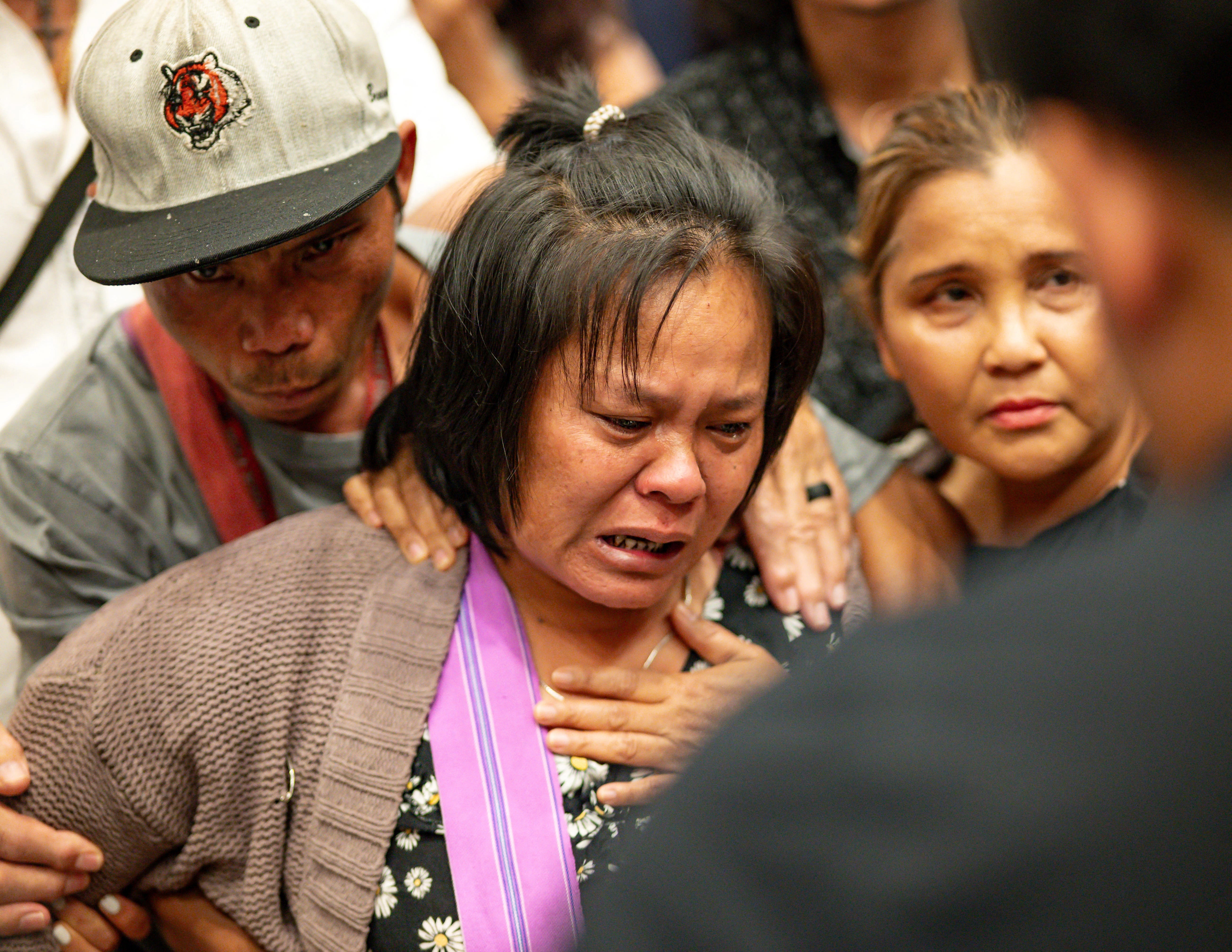 The mother of the 13 year old boy who was shot and killed by Utica Police cries after listening to a translator inside City Hall in Utica, New York, U.S. June 29, 2024.