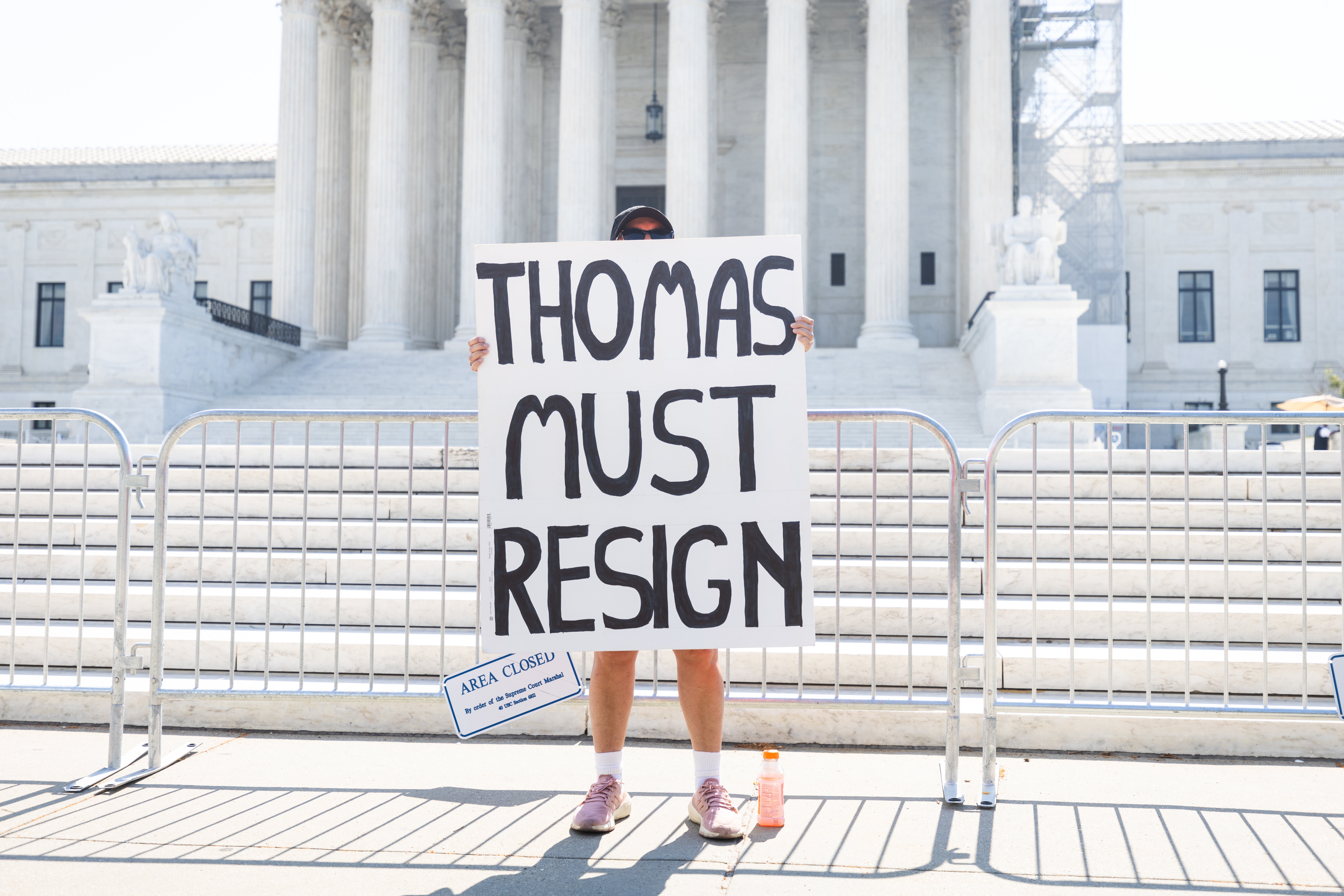 A protester calls for Justice Clarence Thomas to resign outside the Supreme Court on July 1 as the court’s majority granted Donald Trump and other presidents sweeping immunity from criminal prosecution.