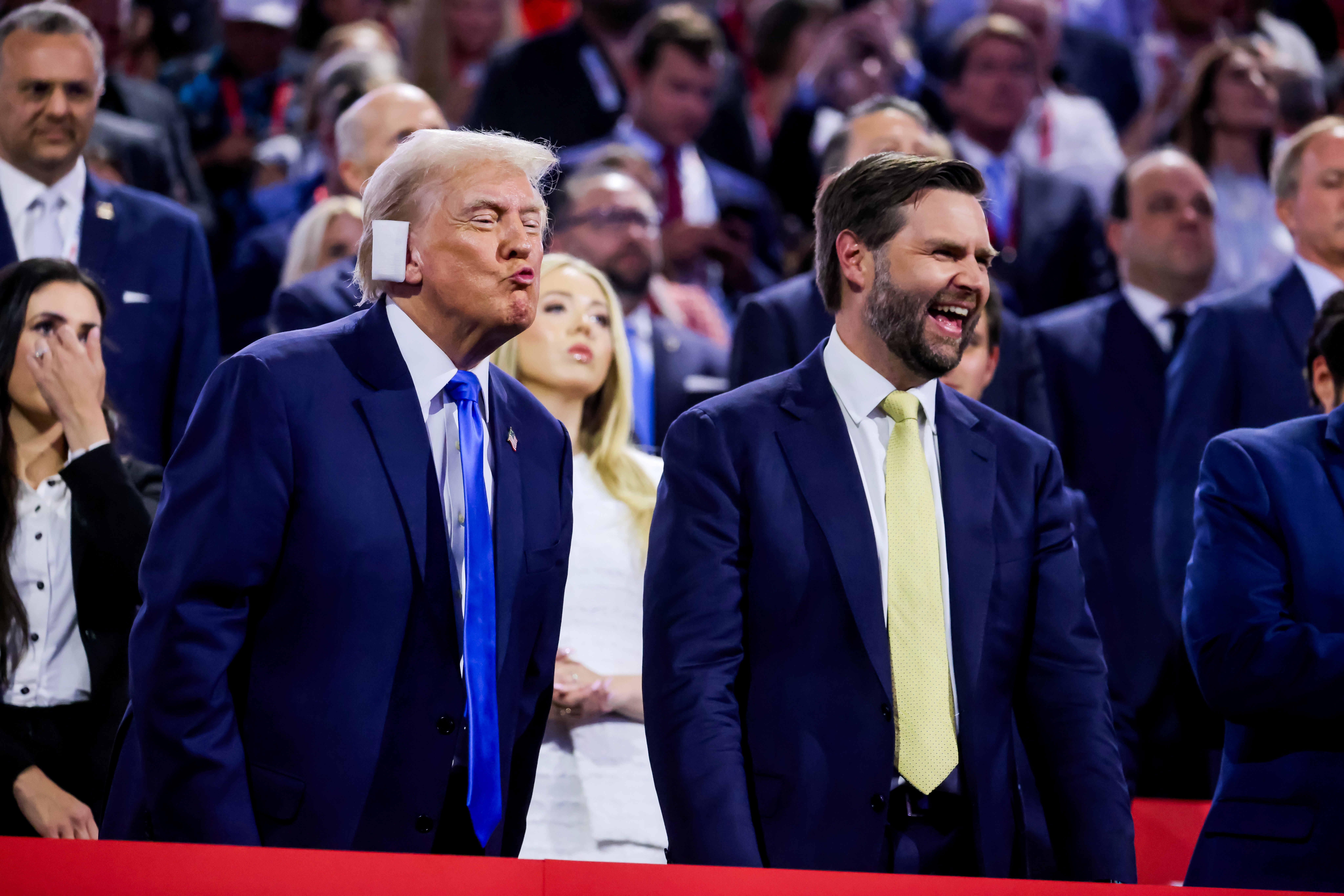 Republican presidential nominee and former President Donald Trump (L), and his vice presidential running mate Senator JD Vance attend the second day of the Republican National Convention.