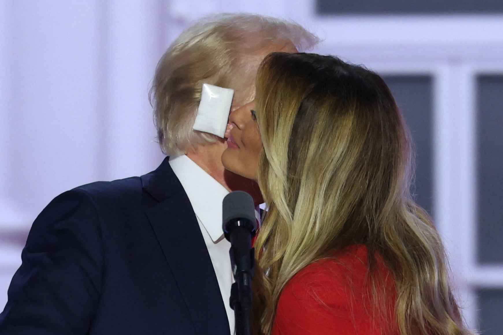 Melania Trump gives her husband a kiss on stage at the Republican National Covention