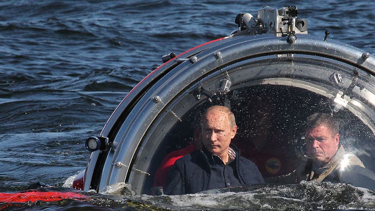 Russian President Vladimir Putin rides in a submersible o  July 15, 2013 in the Baltic Sea near Gotland Island, Russia. The vessel dove to the sea floor to explore a sunken ship in the Gulf of Finland.