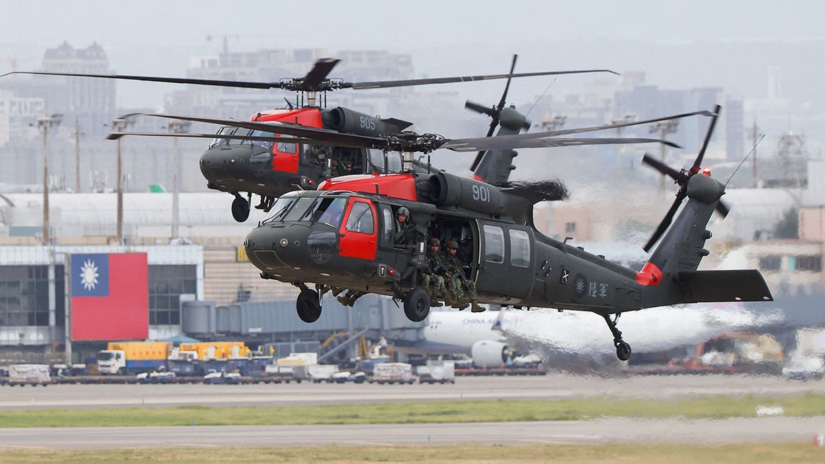 Black Hawk helicopters prepare to land at Taoyuan International Airport as part of the annual Han Kuang military exercise in Taoyuan, Taiwan, in July 2023.