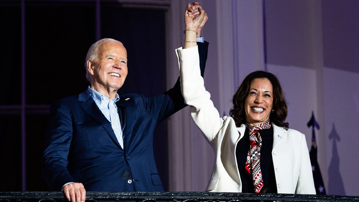 President Biden and Vice President Harris join hands