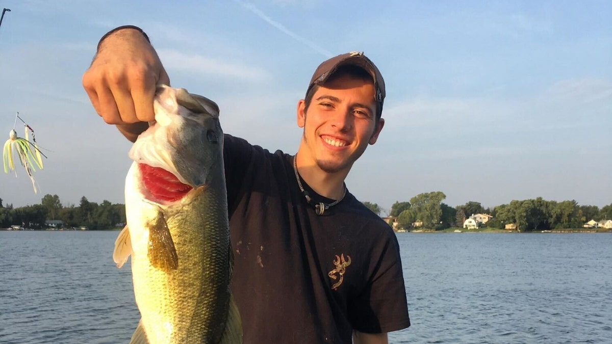 Austin Lockwood holding a fish