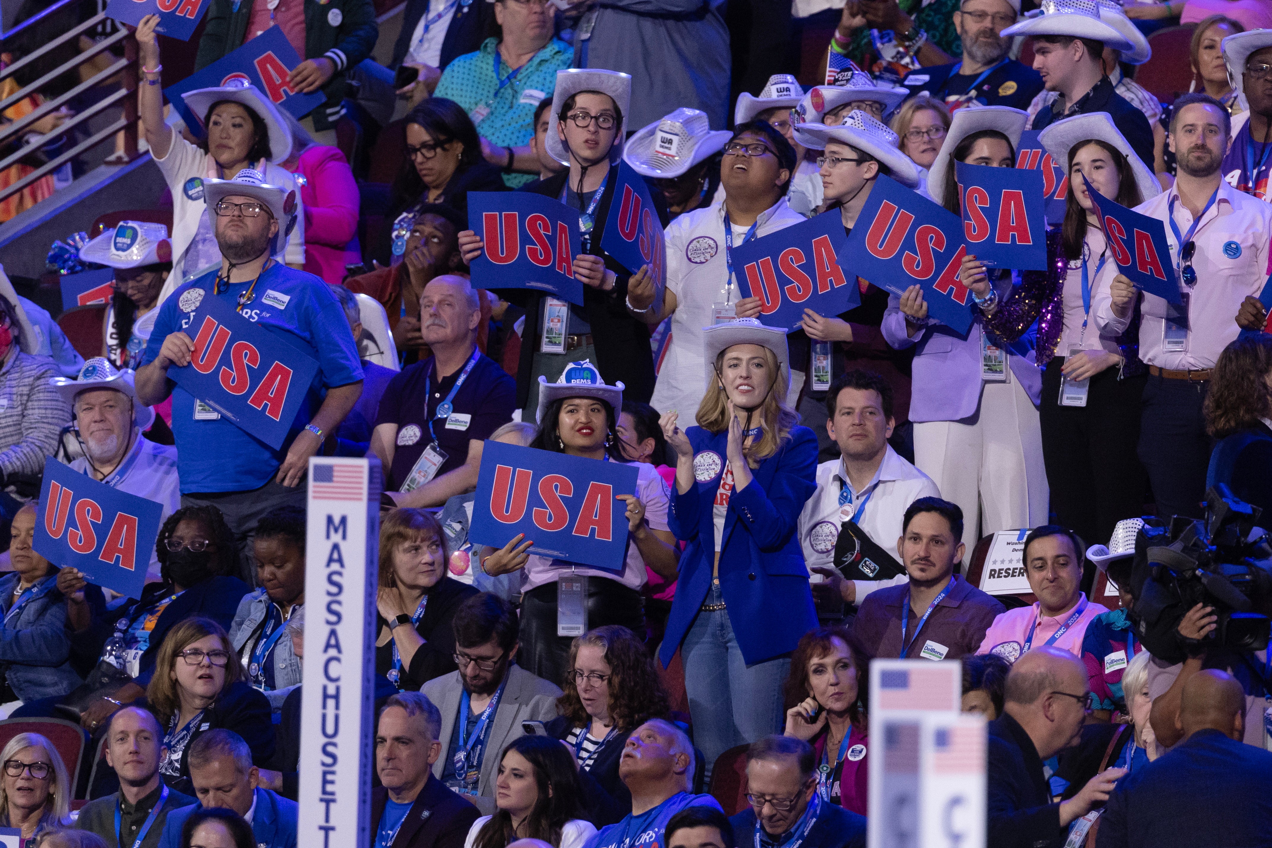 Delegates attend the third night of the Democratic National Convention in Chicago on August 21.