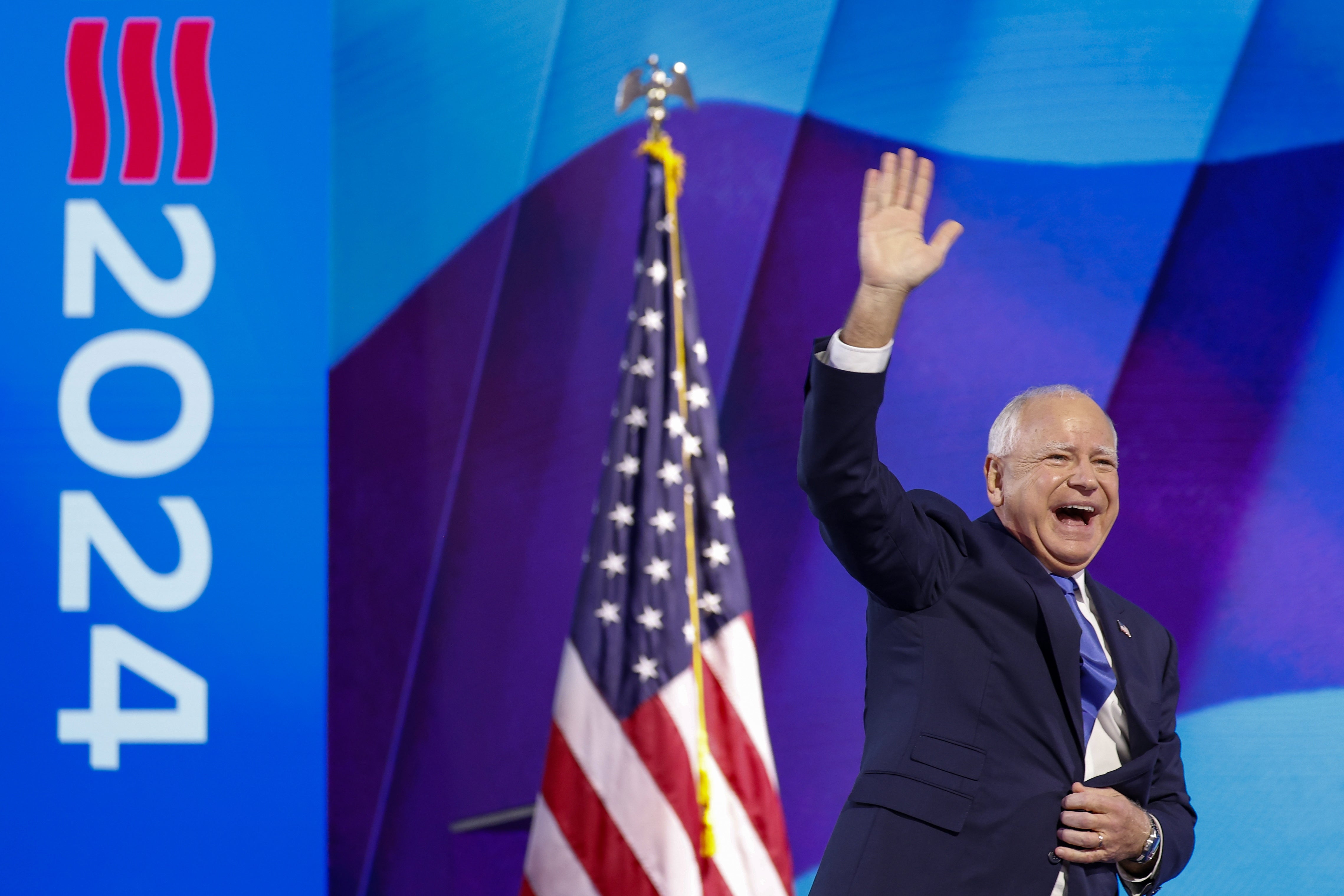 Democratic Vice Presidential nominee Tim Walz walks on to the stage to deliver keynote speech