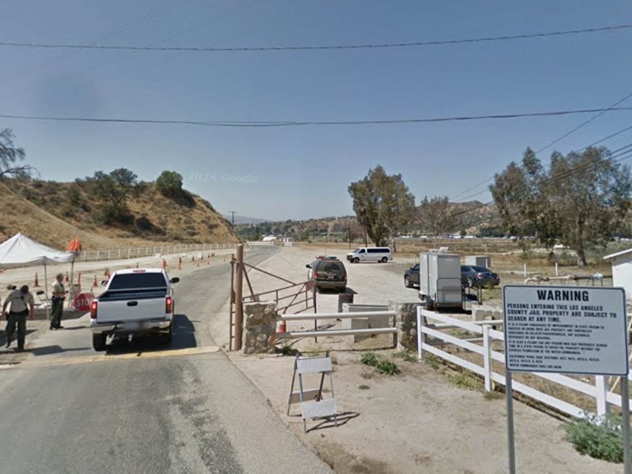 Los Angeles County Sheriff’s deputies check a vehicle at the northern entrance to the Pitchess Detention Center in Castaic, California. On August 9, an inmate at the facility was struck in the ear by a bullet fired during an FBI firearms training exercise at a gun range on the jail complex