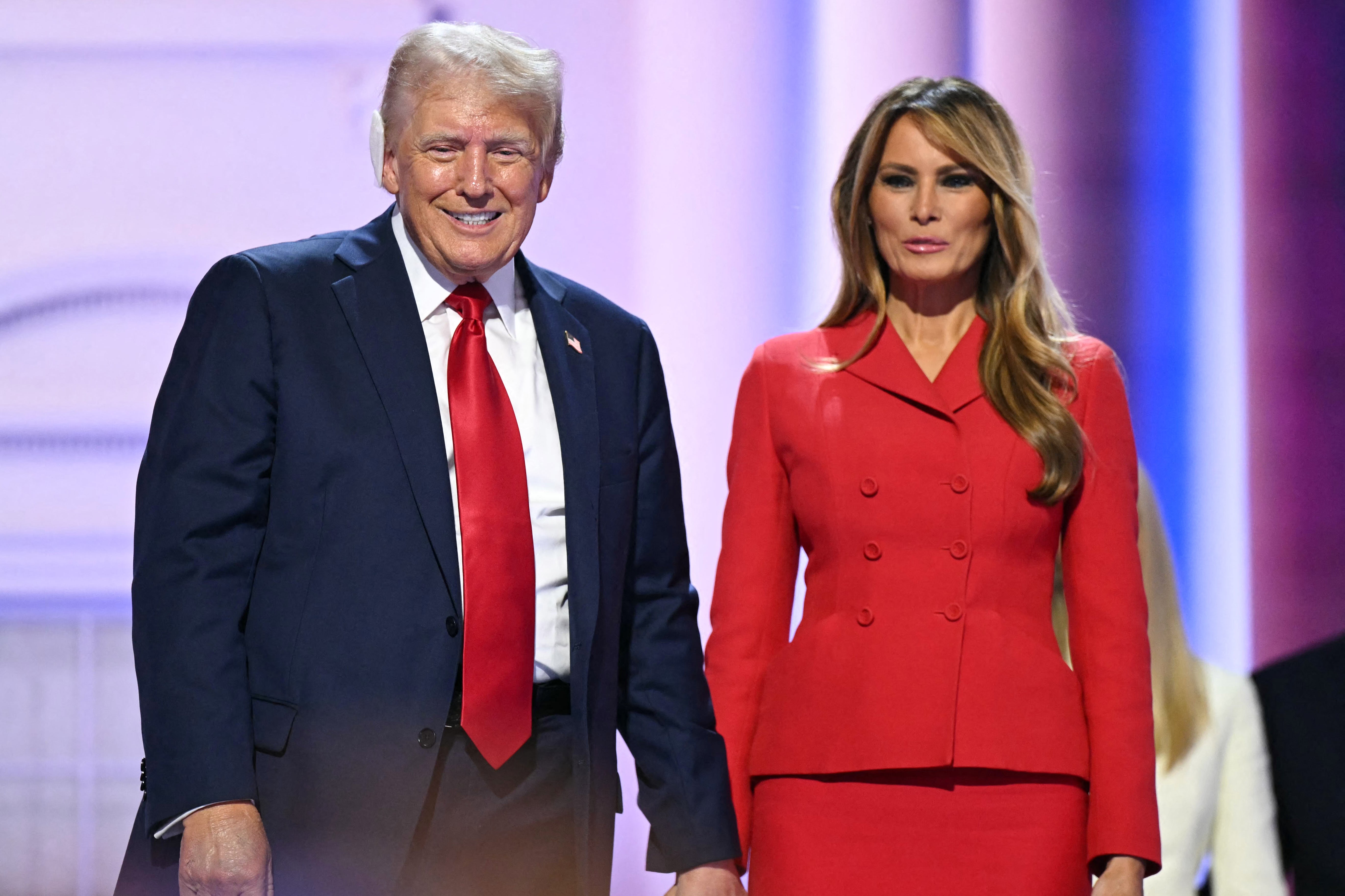 Donald Trump holds hands with Melania Trump on stage after he accepted his party's nomination on the last day of the 2024 Republican National Convention at the Fiserv Forum in Milwaukee, Wisconsin, on July 18. The former first lady’s book is set to be released on October 1