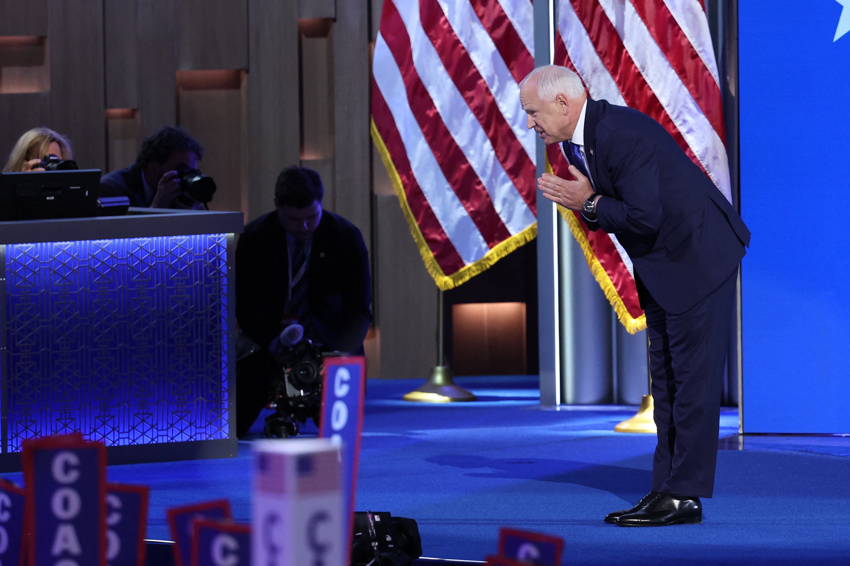 Minnesota Governor Tim Walz takes a bow during his appearance at the end of the third day of the Democratic convention in Chicago on August 21