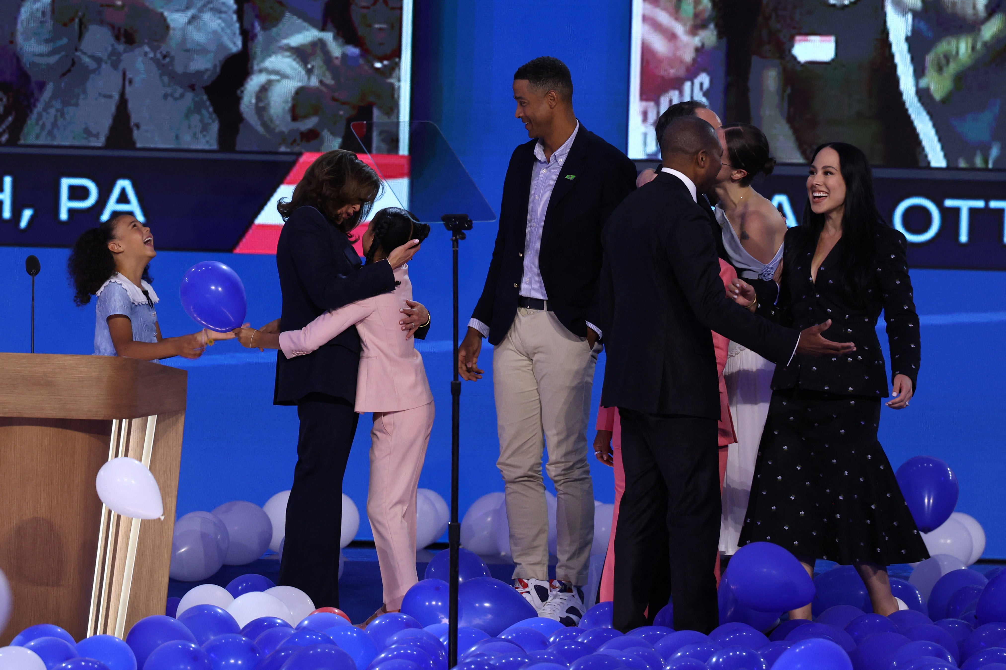 Kamala Harris celebrates with her great-nieces, Amara and Leela, after her Democratic nomination acceptance speech on August 22.