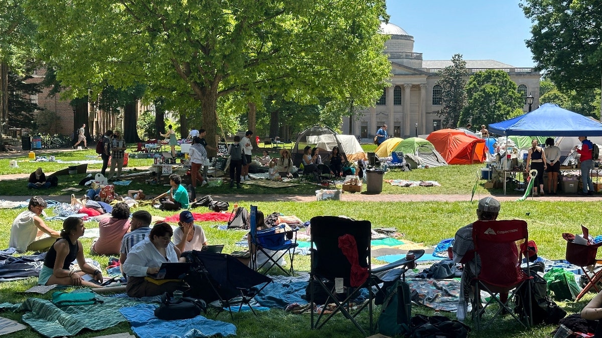 Students work on assignments and listen to organizers as they sit inside the encampment protest in Polk Place on University of North Carolina at Chapel Hill, N.C., on Monday, April 29, 2024.