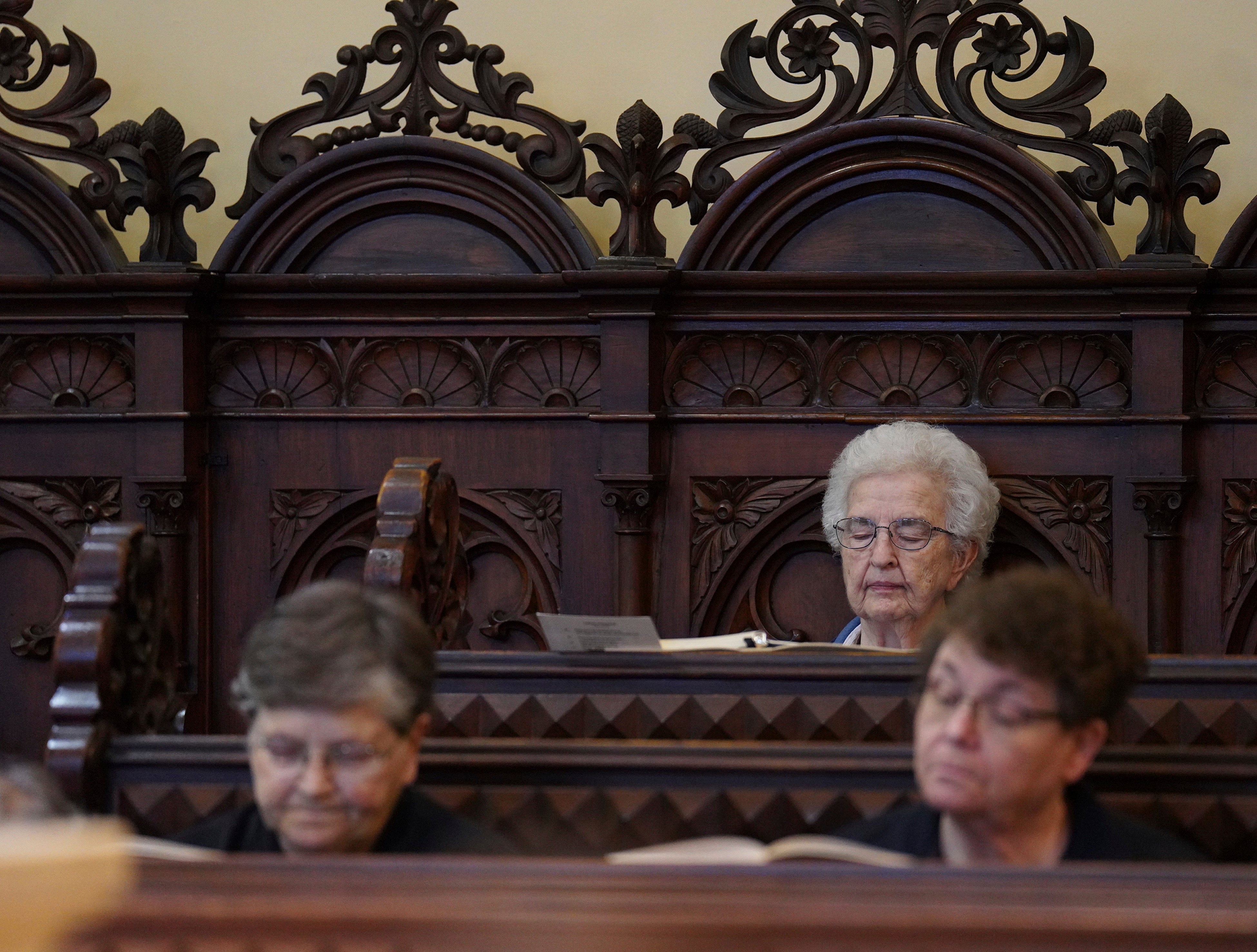 Benedictine sisters sit in silence during evening prayer at the Mount St. Scholastica monastery in Atchison