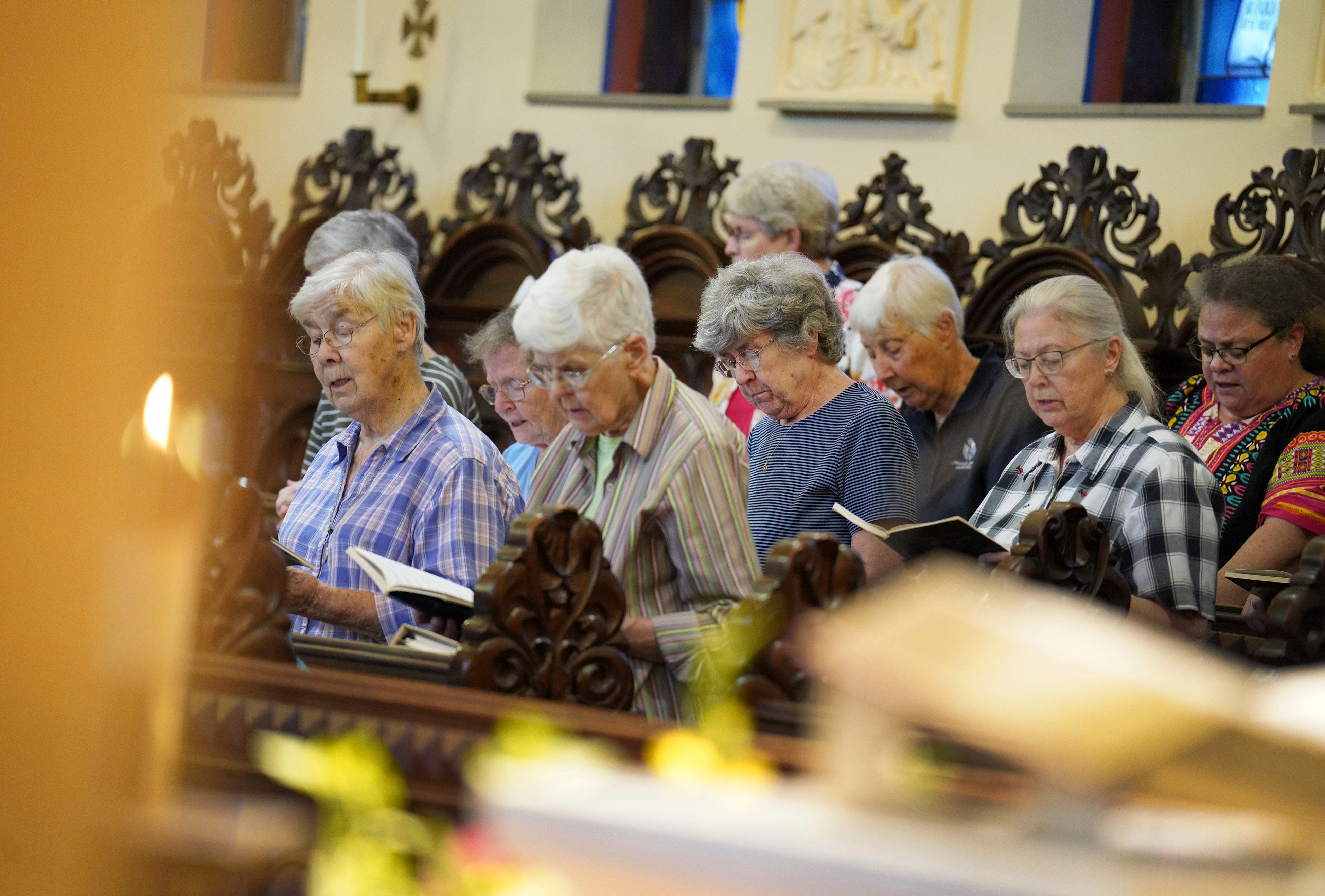 Sisters join in song during evening prayer at the Mount St. Scholastica Benedictine monastery in Atchison