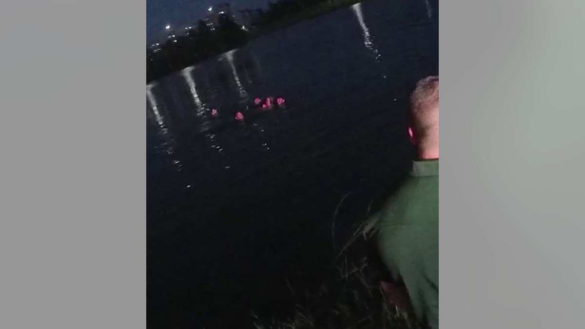 deputies swimming with woman