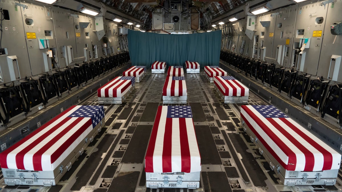 Caskets of 13 service members killed on airplane