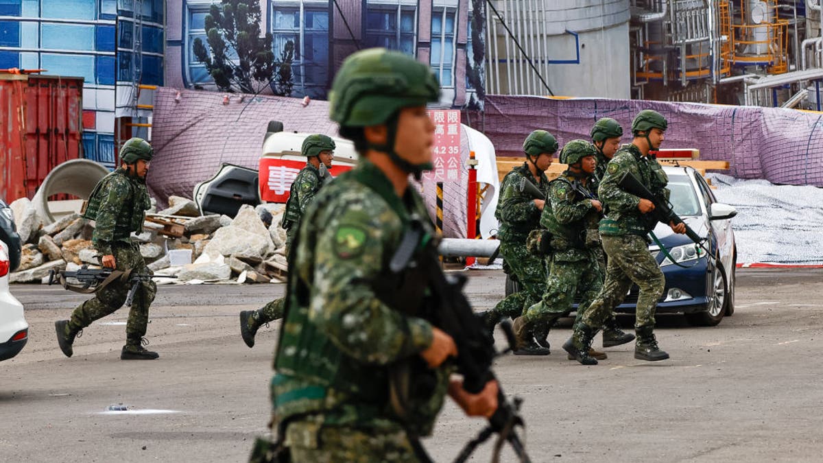 Taiwanese soldiers are deployed during a war and disaster drill as part of the annual Wan-An Air Raid Drill, at a seaport in New Taipei, Taiwan, on July 23, 2024. The drill, which coincides with the annual Han Kuang Exercise, is a joint exercise by nearly 2,000 individuals from government agencies including the military, fire fighting and rescue services.