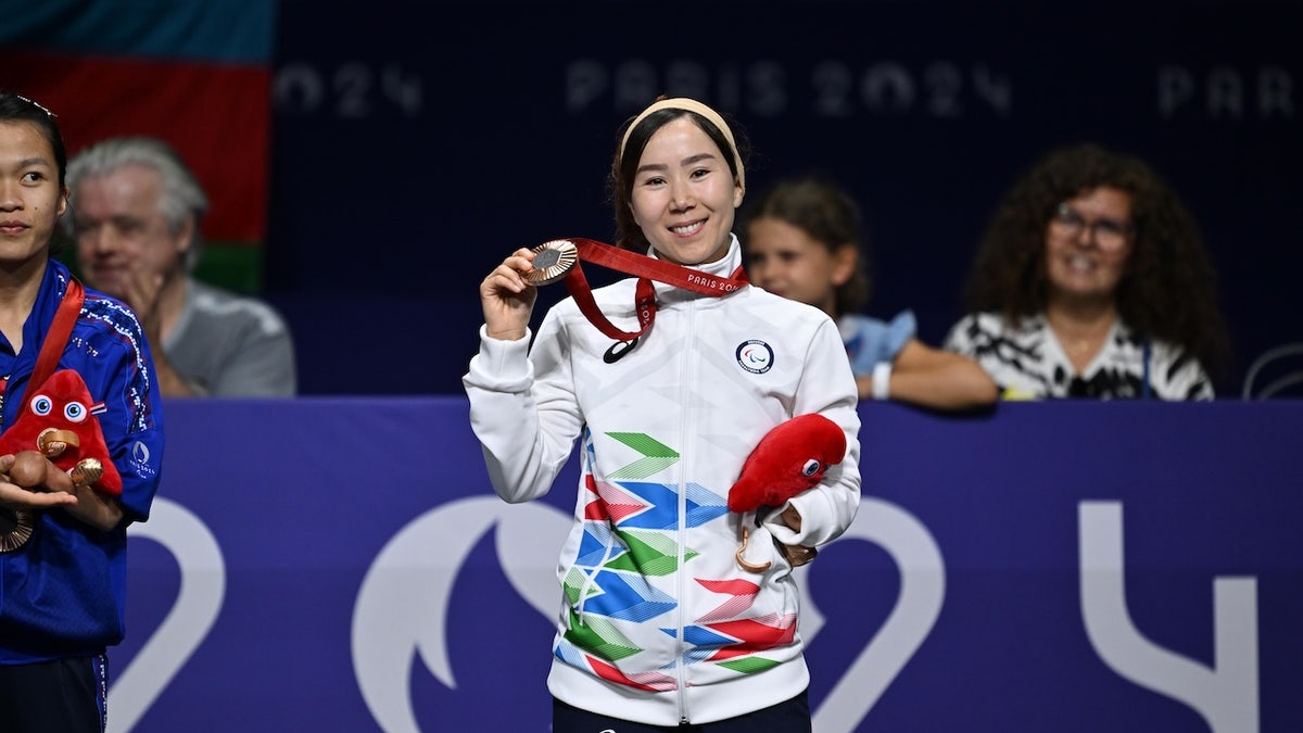 Bronze medallist Zakia Khudadadi of Refugee Paralympic Team poses during medal ceremony after the women's Para Taekwondo K44 -47kg final on day one of the Paris 2024 Summer Paralympic Games at Grand Palais on Aug. 29, 2024 in Paris.