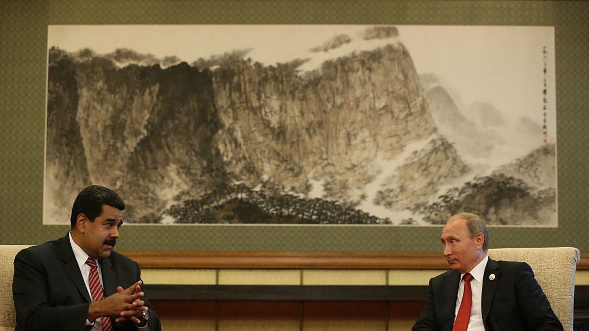 Russian President Vladimir Putin, right, and Venezuelan President Nicolás Maduro speak at a bilateral meeting on Sept. 3, 2015 in Beijing.