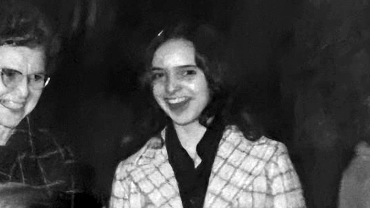 Patricia Mak wearing a plaid jacket and smiling.