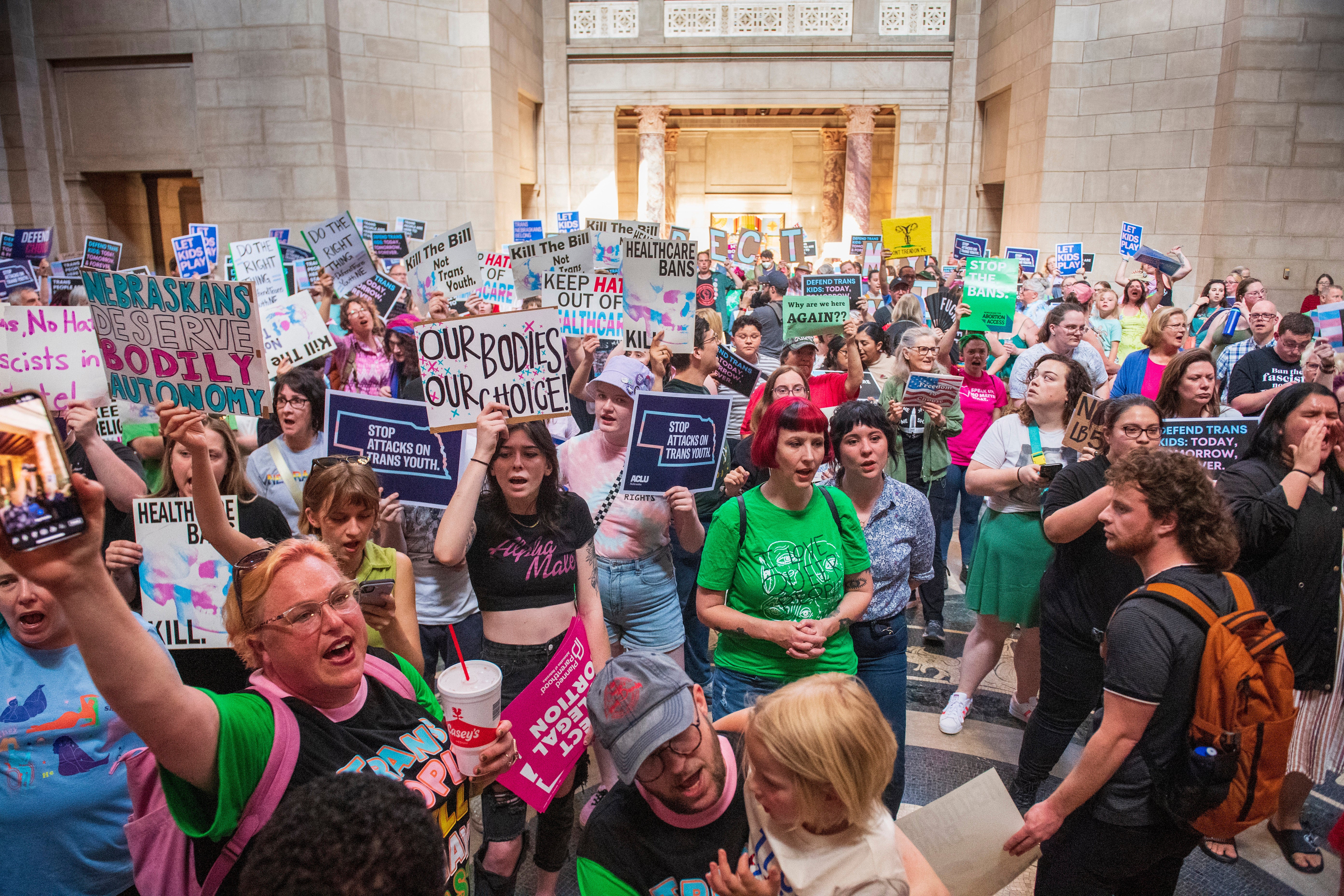 Protesters chant as they are heard in the legislative chamber during a final reading on a bill that combined a 12-week abortion ban with a measure to restrict gender-affirming care for people under 19 on May 16, 2023