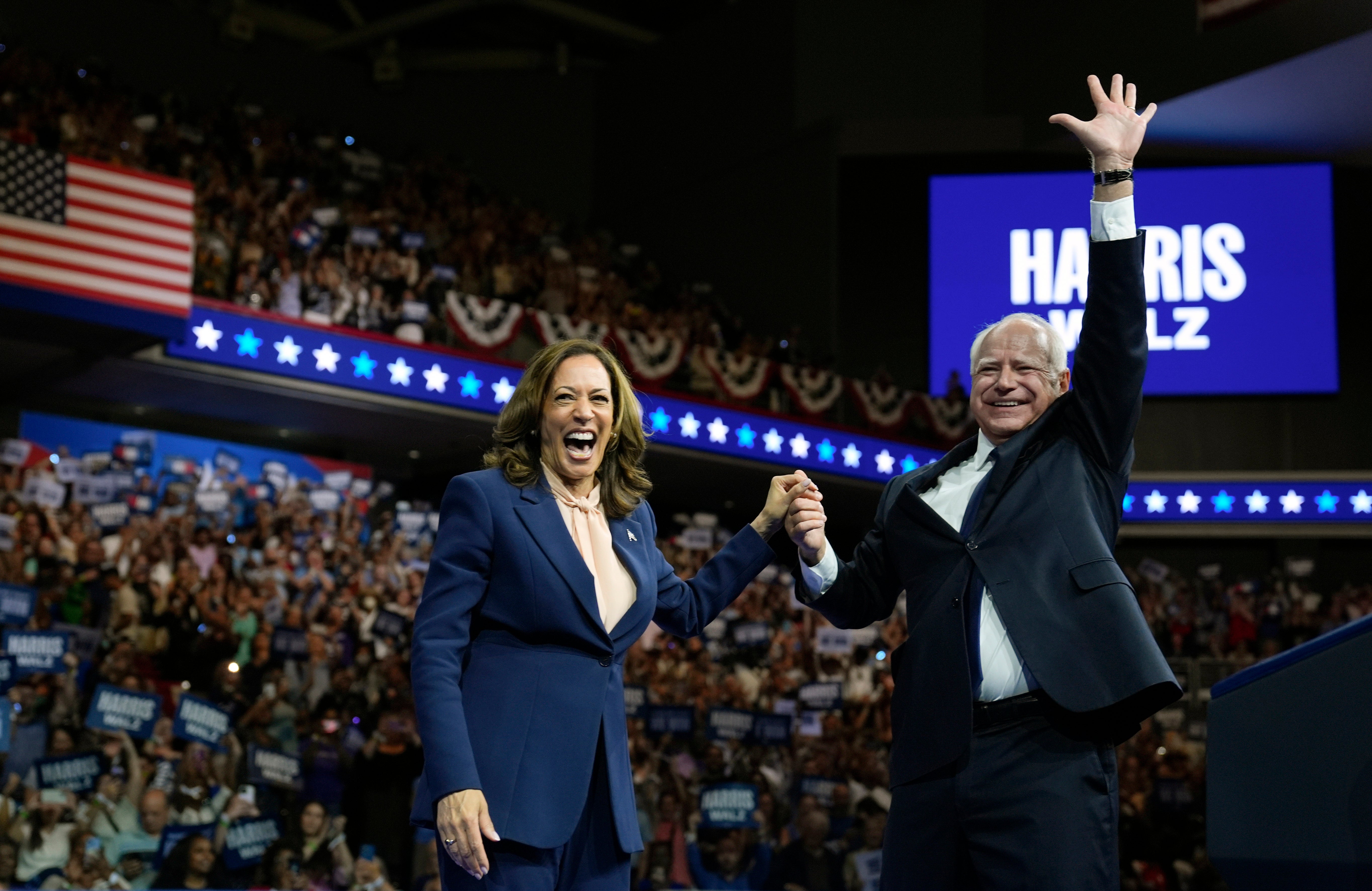 Democratic presidential nominee Vice President Kamala Harris accompanied, left, by her running mate Minnesota Gov. Tim Walz. The two are set for rallies across the US including one hours before former president Obama speaks at the DNC.