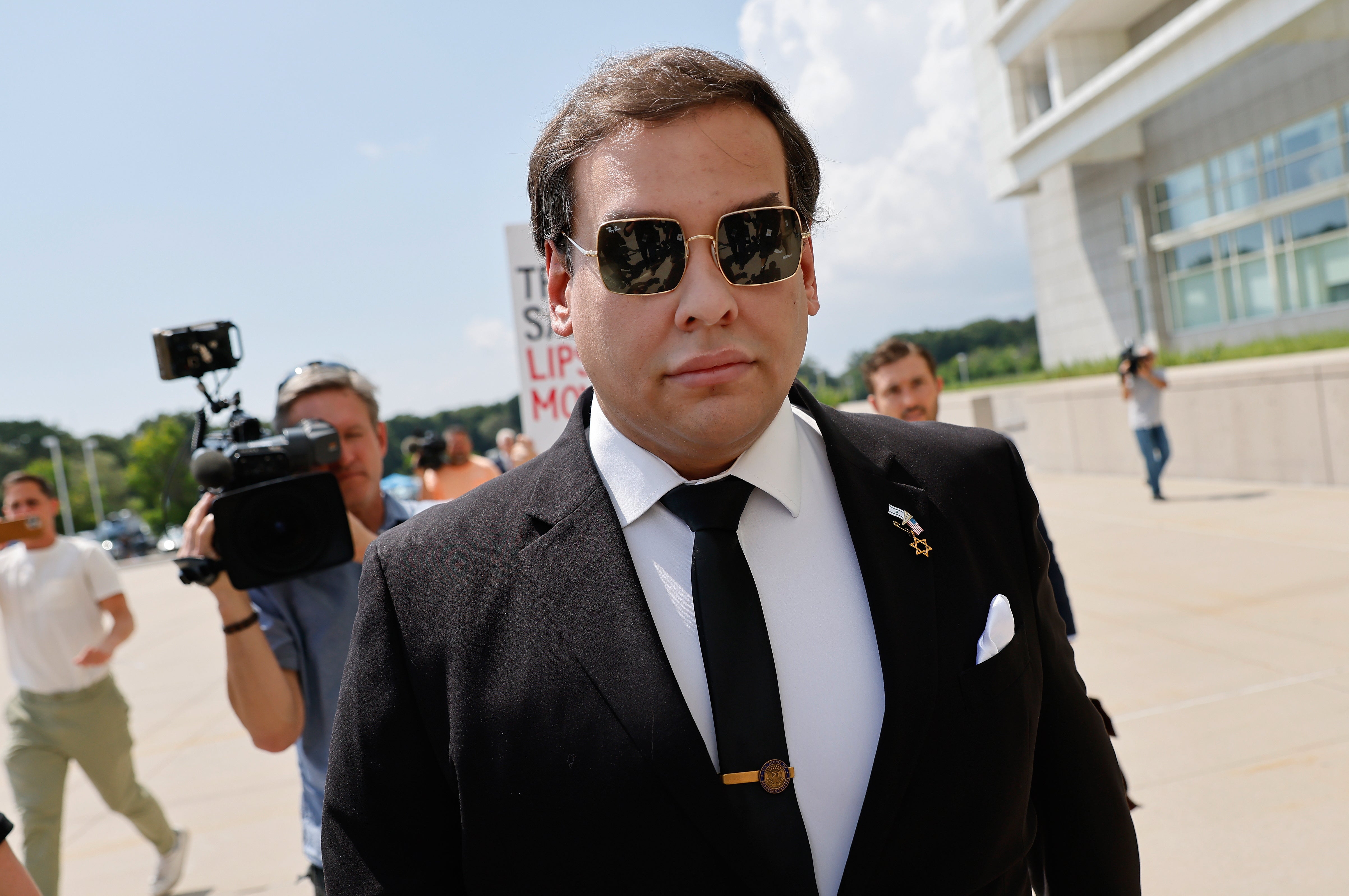 George Santos walking into federal court in Central Islip, New York on Monday. He previously pleaded not guilty to the 23 criminal charges against him