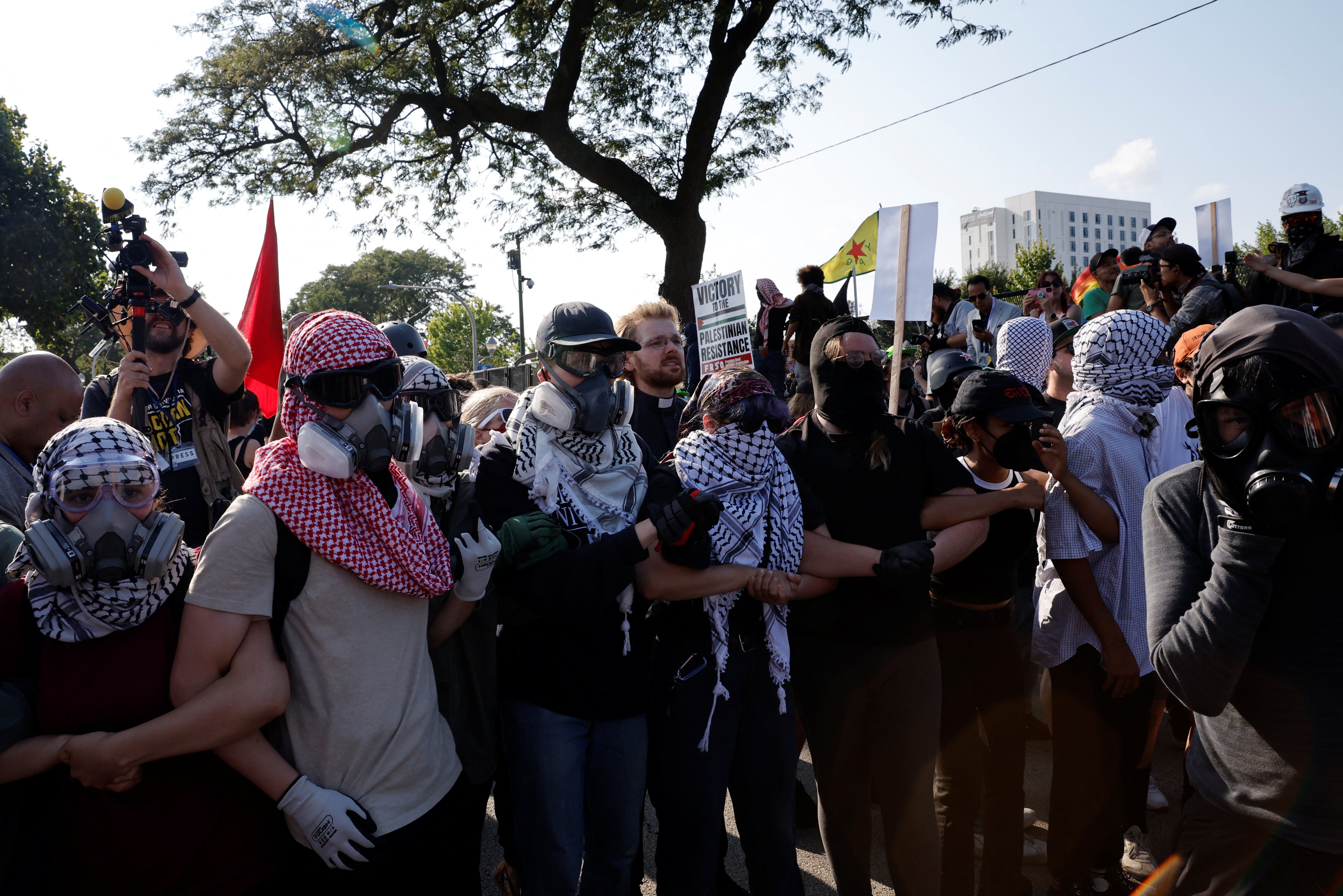 People attend a rally "March on the DNC" on the sidelines of the Democratic National Convention (DNC) in Chicago, Illinois, U.S., August 19, 2024