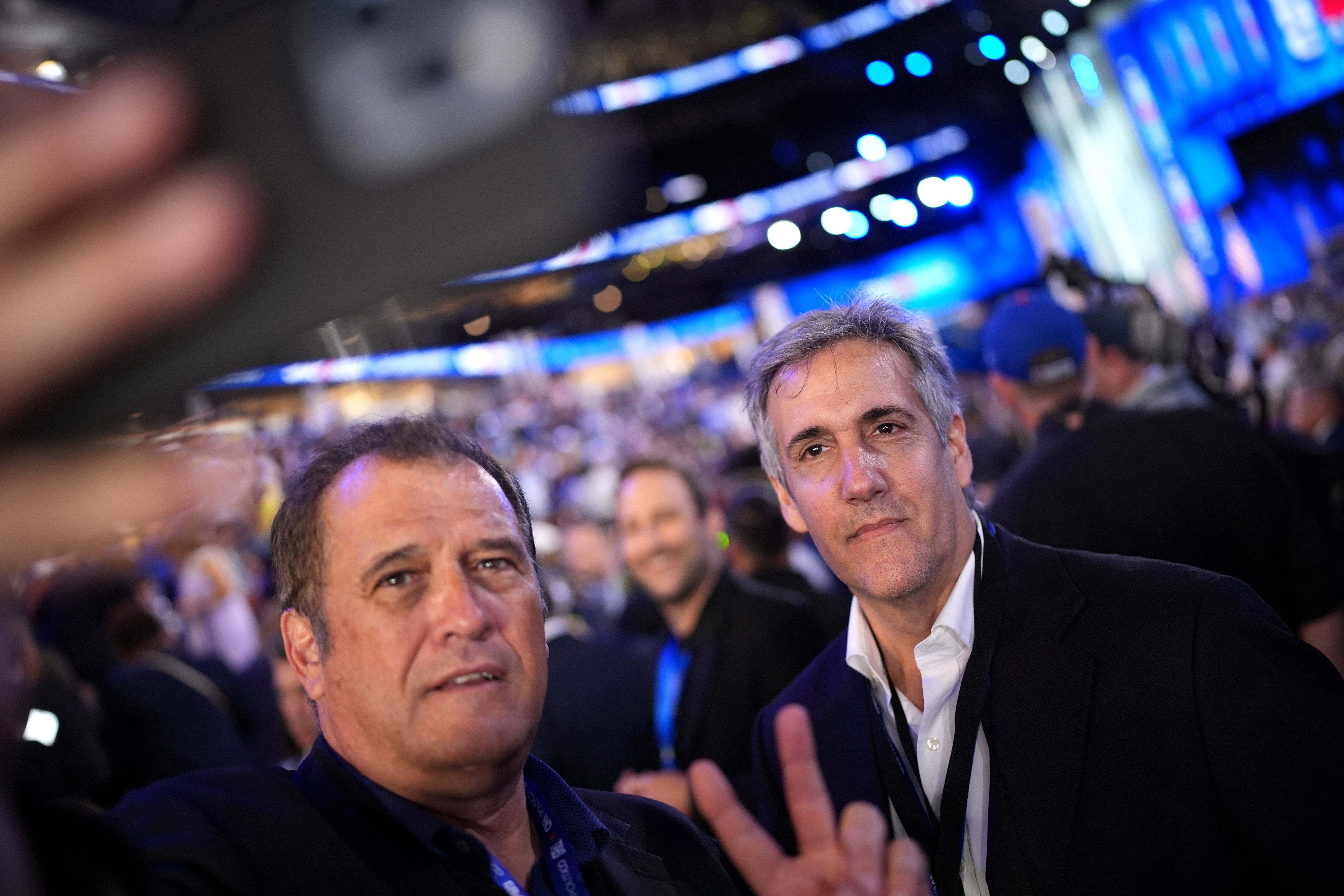 Journalist Brian Karem poses for a selfie with Michael Cohen, former personal lawyer to former U.S. President Donald Trump, during the second day of the Democratic National Convention at the United Center on August 20, 2024 in Chicago, Illinois. The former fixer was not the only former Trump ally to attend the DNC