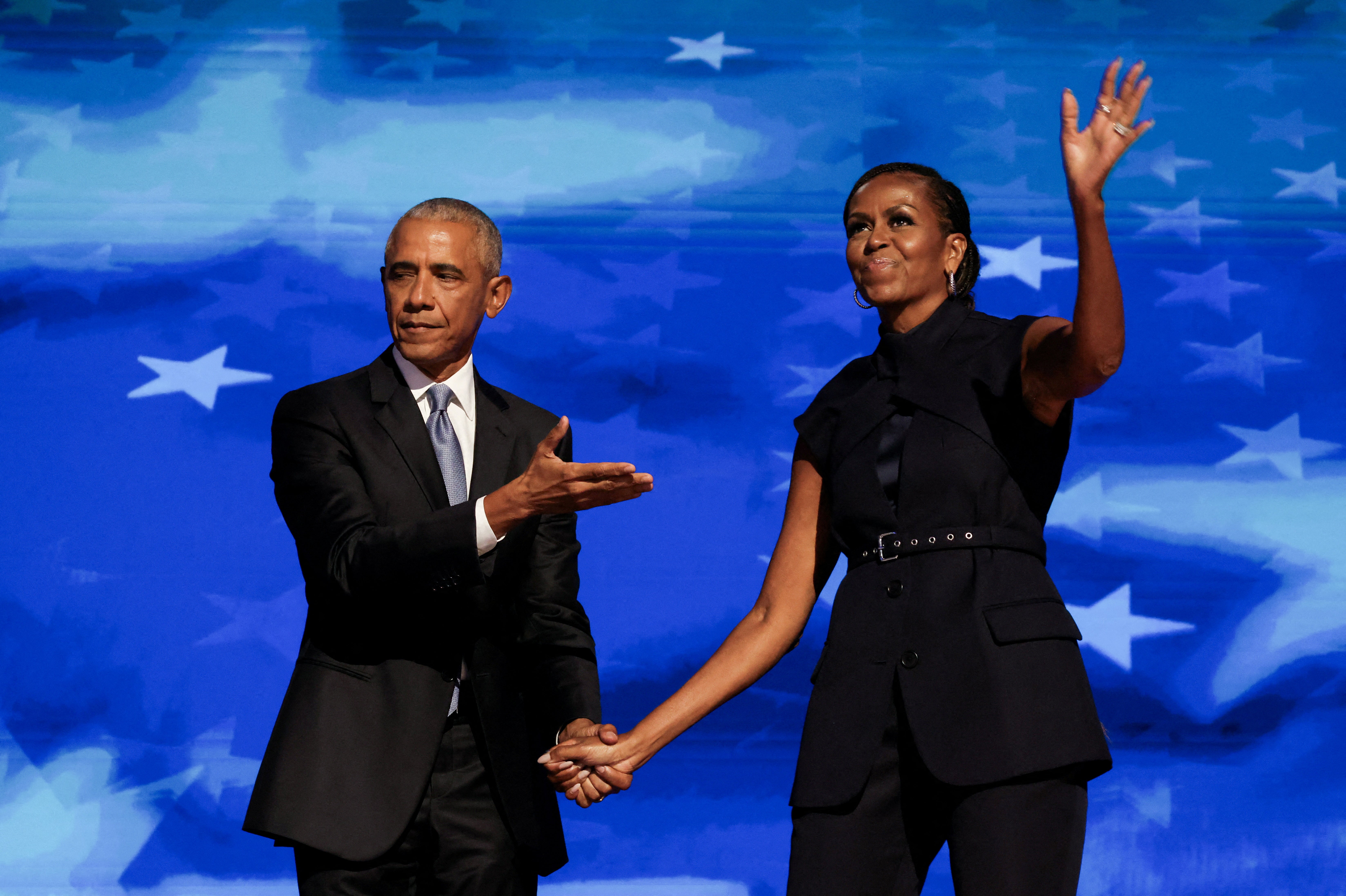 Former first lady Michelle Obama greets her husband, former president Barack Obama, on stage during night two of the Democratic National Convention in Chicago. Viewership of the DNC spiked during their speeches