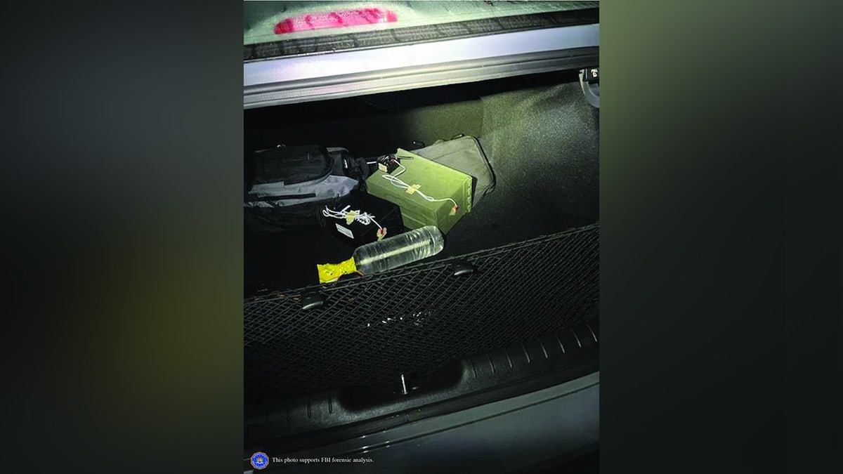 An evidence photo shows two explosive devices found in the trunk of Thomas Crooks' car following the assassination attempt of former President Donald Trump