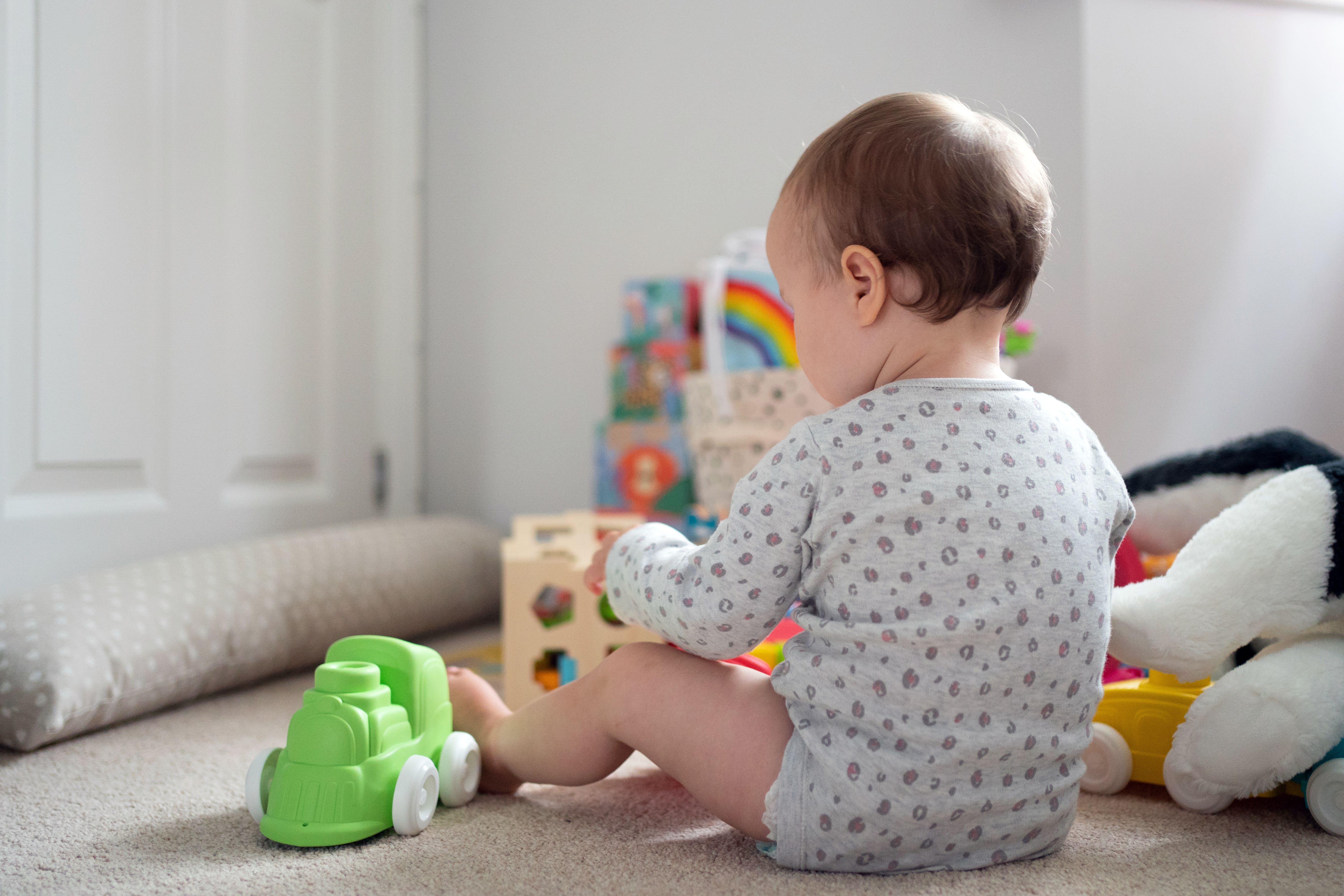 A baby who is wide awake and not sleeping in its Snoo