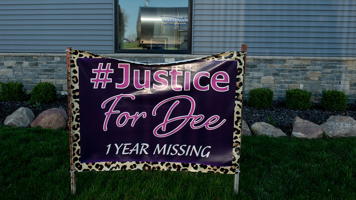 A sign calling for justice for Dee Warner