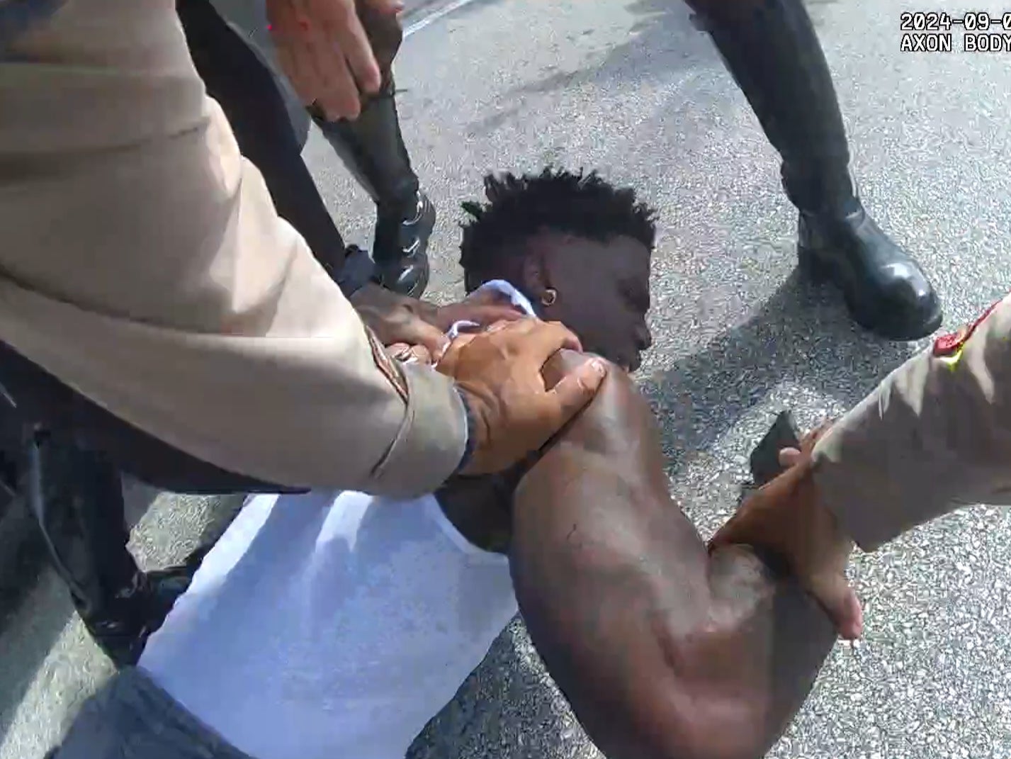 Miami police push Tyreek Hill to the ground on September 8, 2024