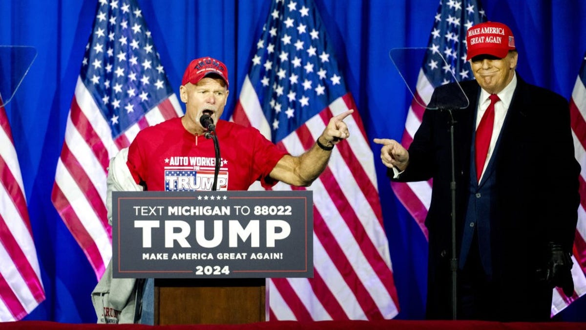 Brian Pannebecker at podium with former President Trump to his left