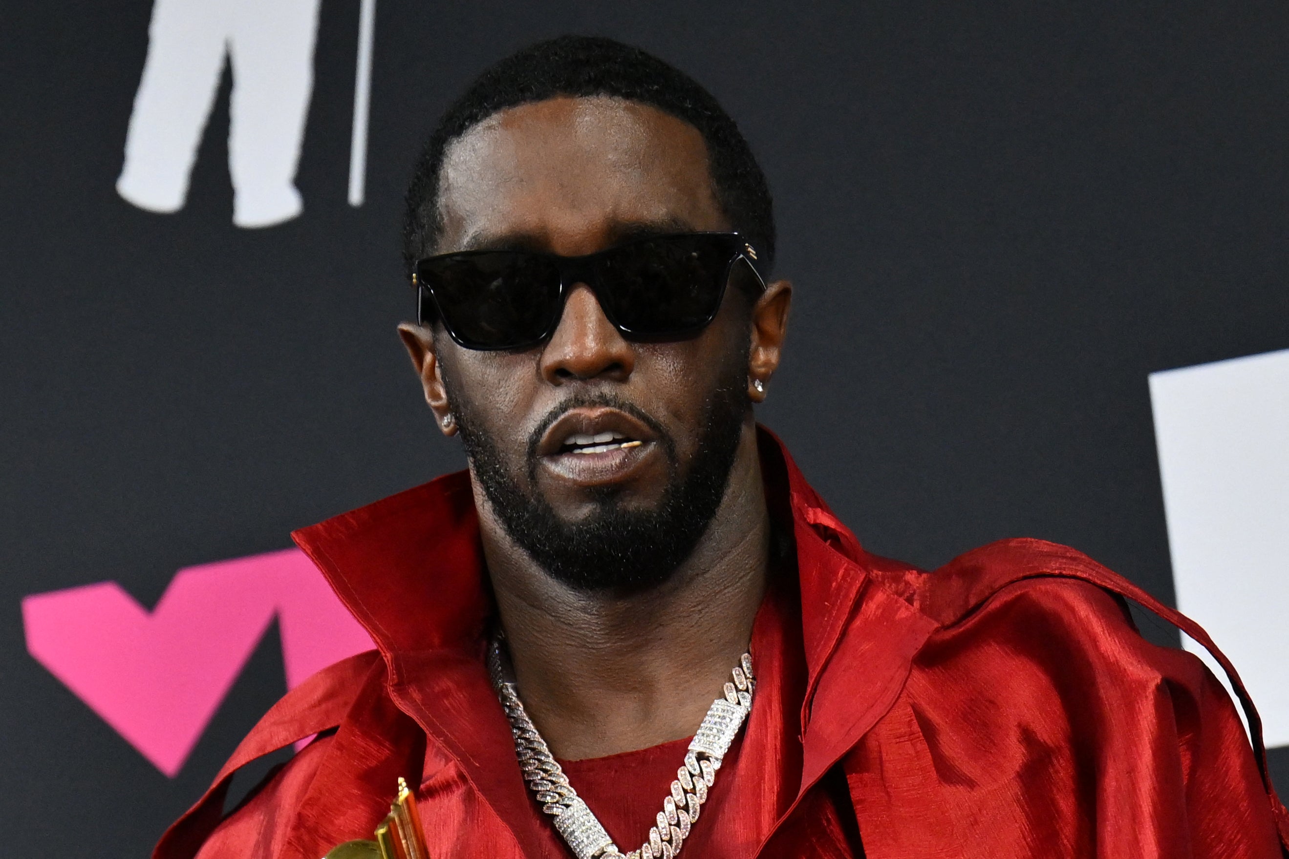 Combs poses with the Global Icon award in the press room during the MTV Video Music Awards last September; multiple lawsuits against him were filed in the same week just months later