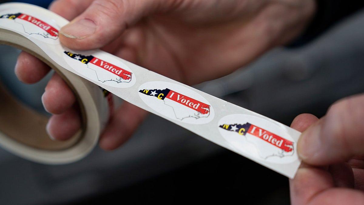 North Carolina voting sticker roll held in hands