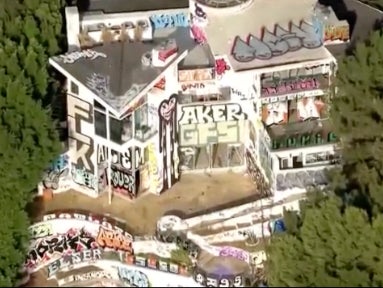 An aerial view of an abandoned mansion at 7571 Mulholland Drive in Los Angeles, which has been taken over by taggers and squatters.