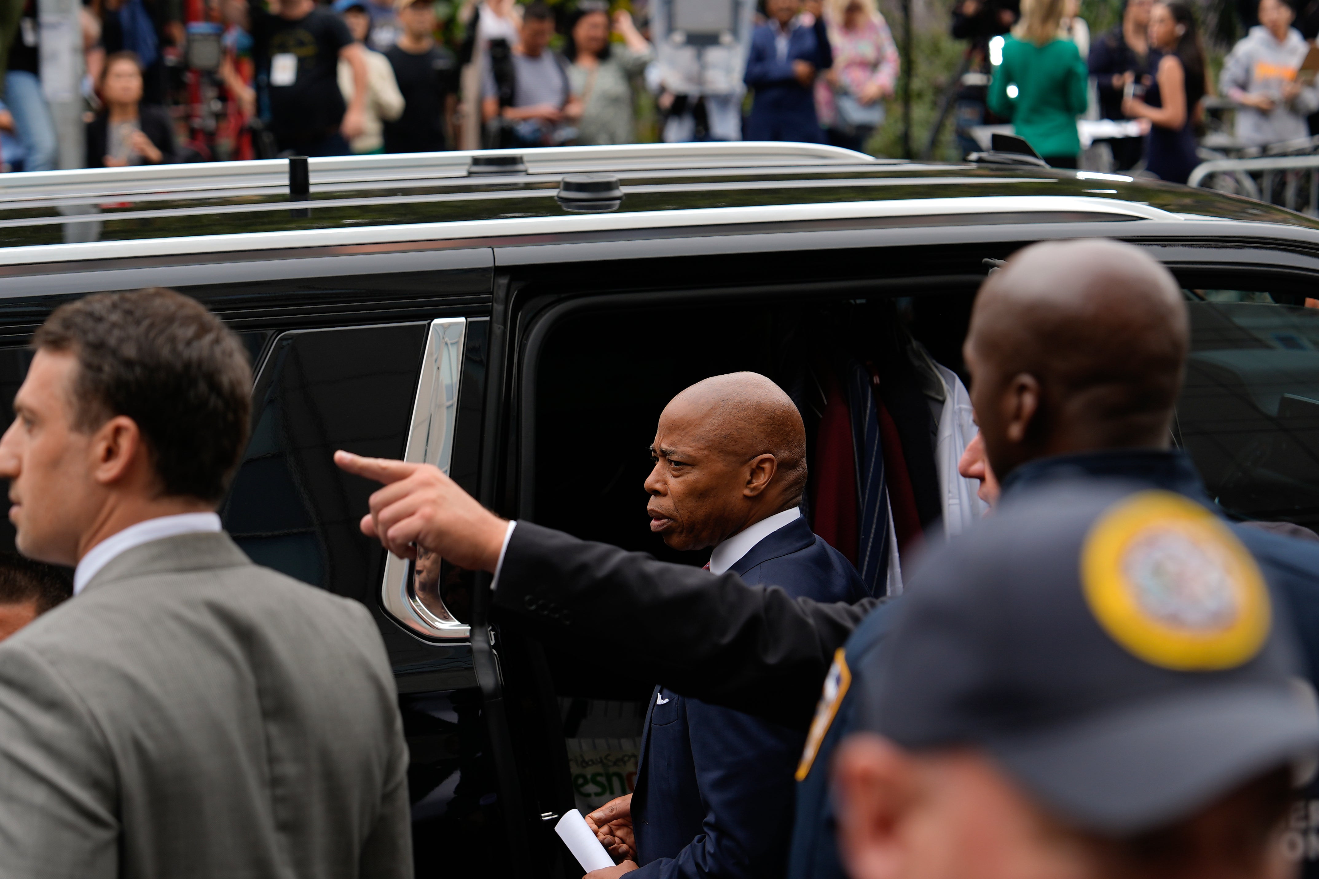 Crowds of people took up the sidewalk in front of, and across the street from, the federal courthouse where New York City Mayor Eric Adams was arraigned. It created a circus-like atmosphere