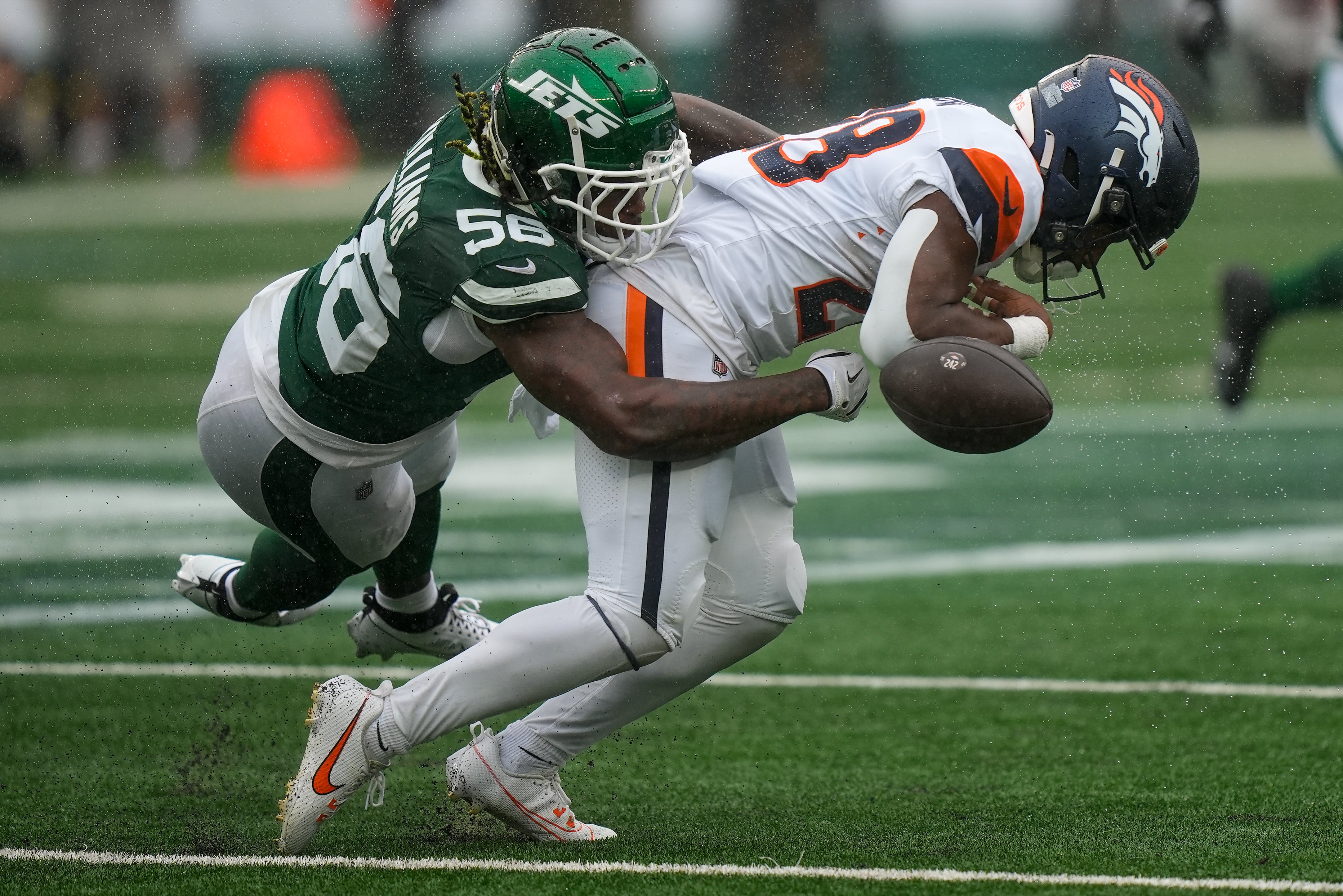 Badie (right) had caught a pass on a third down play shortly before the end of the opening quarter and was immediately hit by the Jets’ Quincy Williams (left)