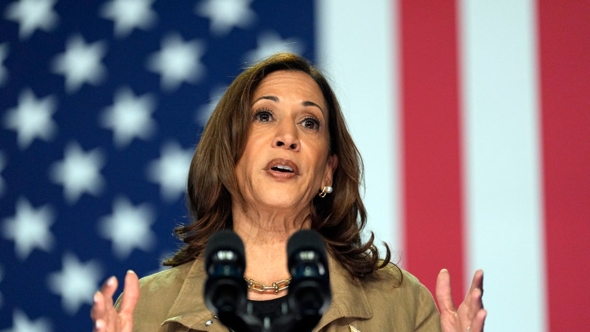 closeup shot of Kamala Harris with US flag behind her