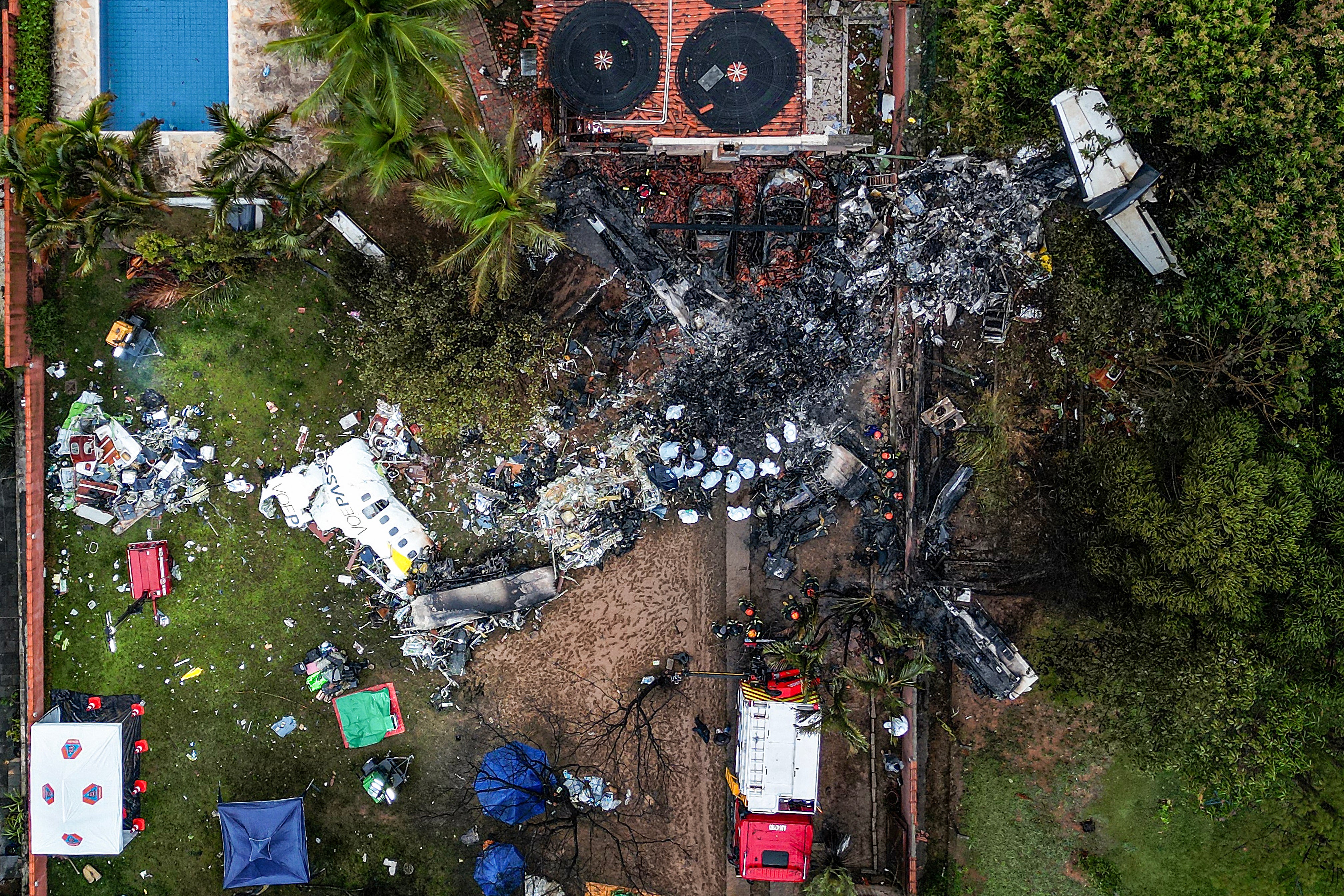 This photo shows an aerial view of the wreckage of an airplane that crashed with 61 people on board in Vinhedo, Sao Paulo State, Brazil, on 10 August 2024