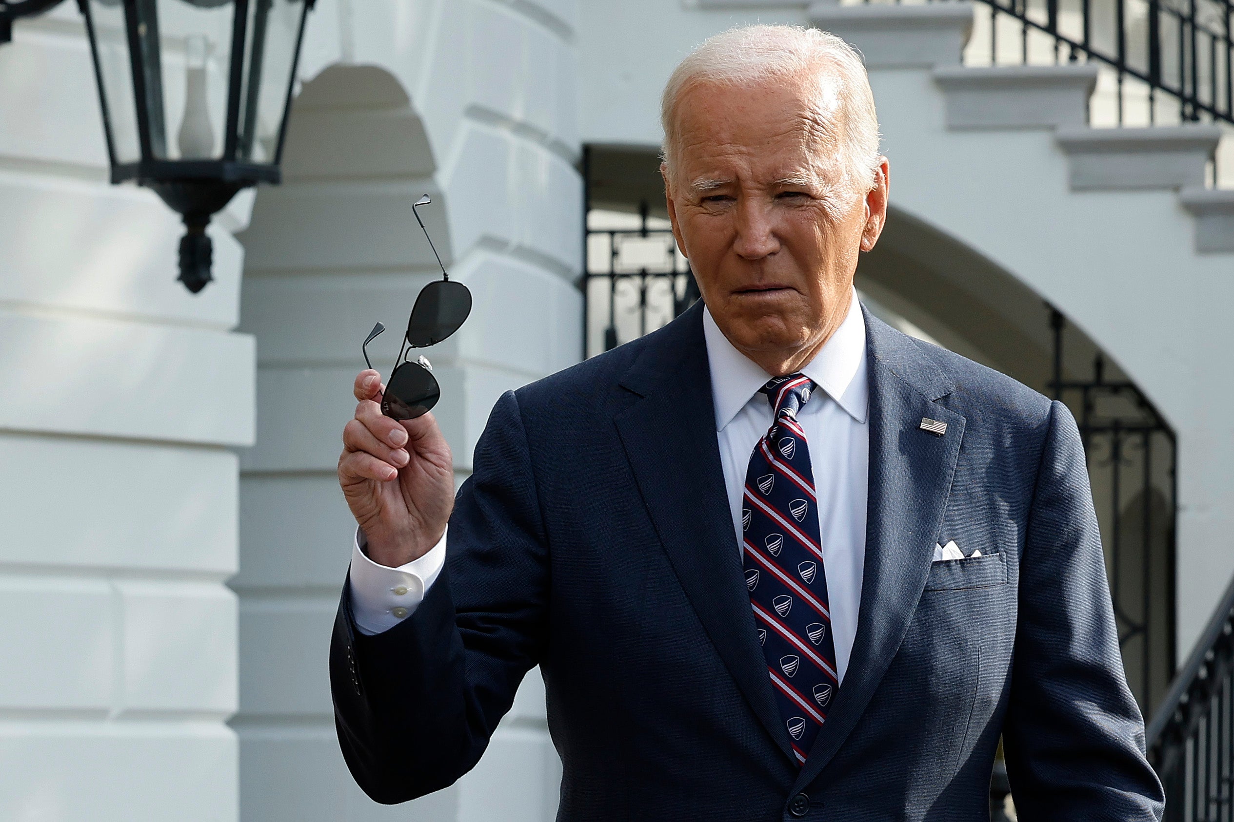 Biden approaches reporters as he departs the White House earlier this week