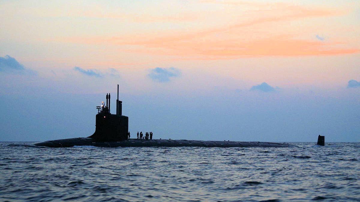 The nation's newest and most advanced nuclear-powered attack submarine PCU Virginia (SSN 774) travels along the morning sunrise skyline on its way from Norfolk Naval Shipyard to complete Bravo sea trials. Virginia is the Navy's only major combatant ready to join the fleet that was designed with the post-Cold War security environment in mind and embodies the war fighting and operational capabilities required to dominate the littorals while maintaining undersea dominance in the open ocean.