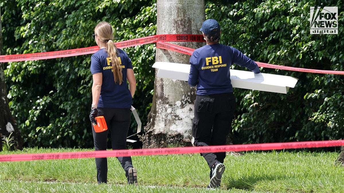 FBI investigators carry a box of evidence from the perimeter of Trump International Golf Club in West Palm Beach, Florida on Monday, September 16, 2024. Ryan Routh was arrested earlier this week after allegedly attempting to assassinate former President Donald Trump while hiding in the bushes along the golf course. (Mega for Fox News Digital)