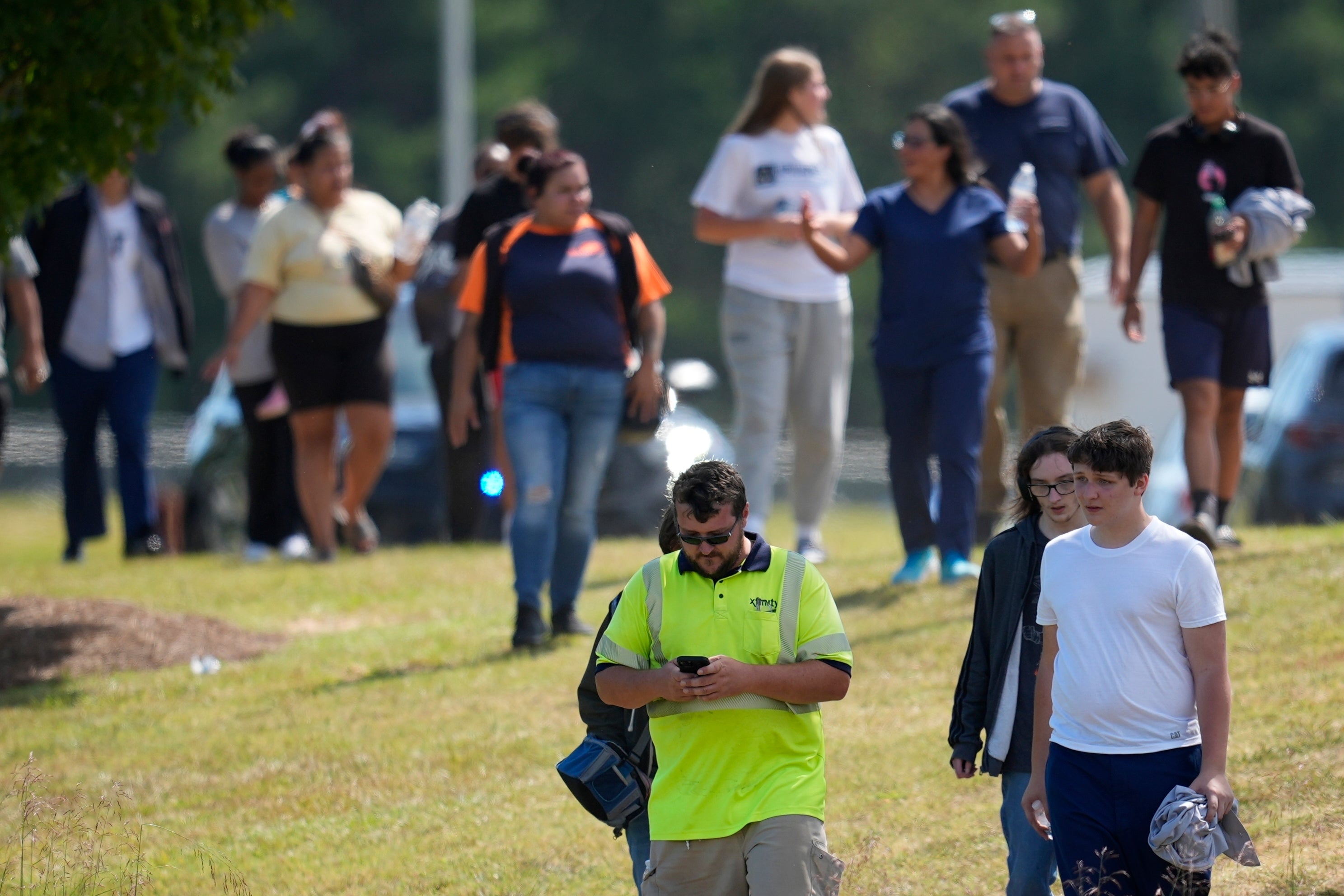 Reunited students and parents leave Apalachee High School on September 4 in Winder, Georgia