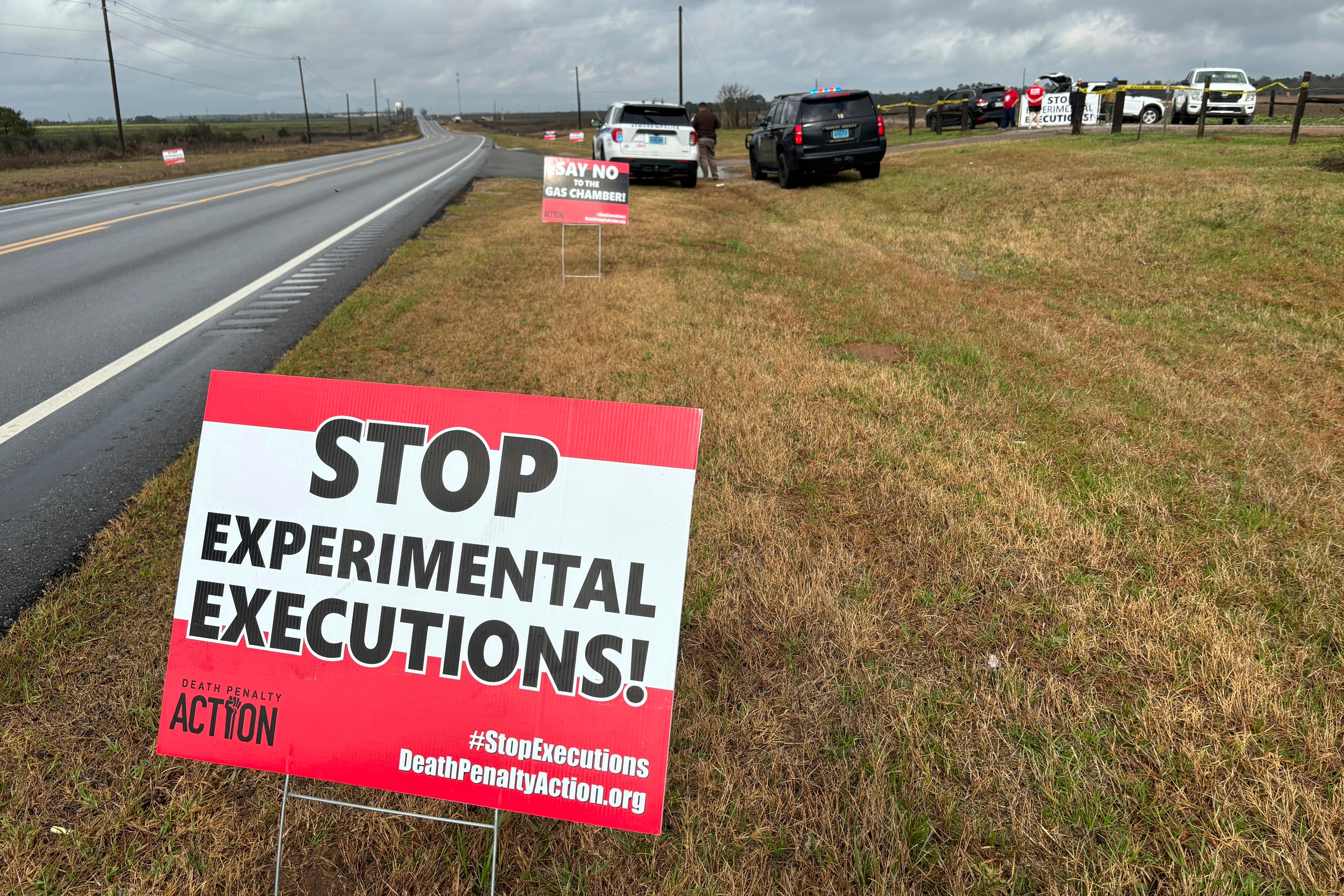 Anti-death penalty signs placed by activists along the road heading to Holman Correctional Facility in Atmore, Alabama before Kenneth Eugene Smith’s execution