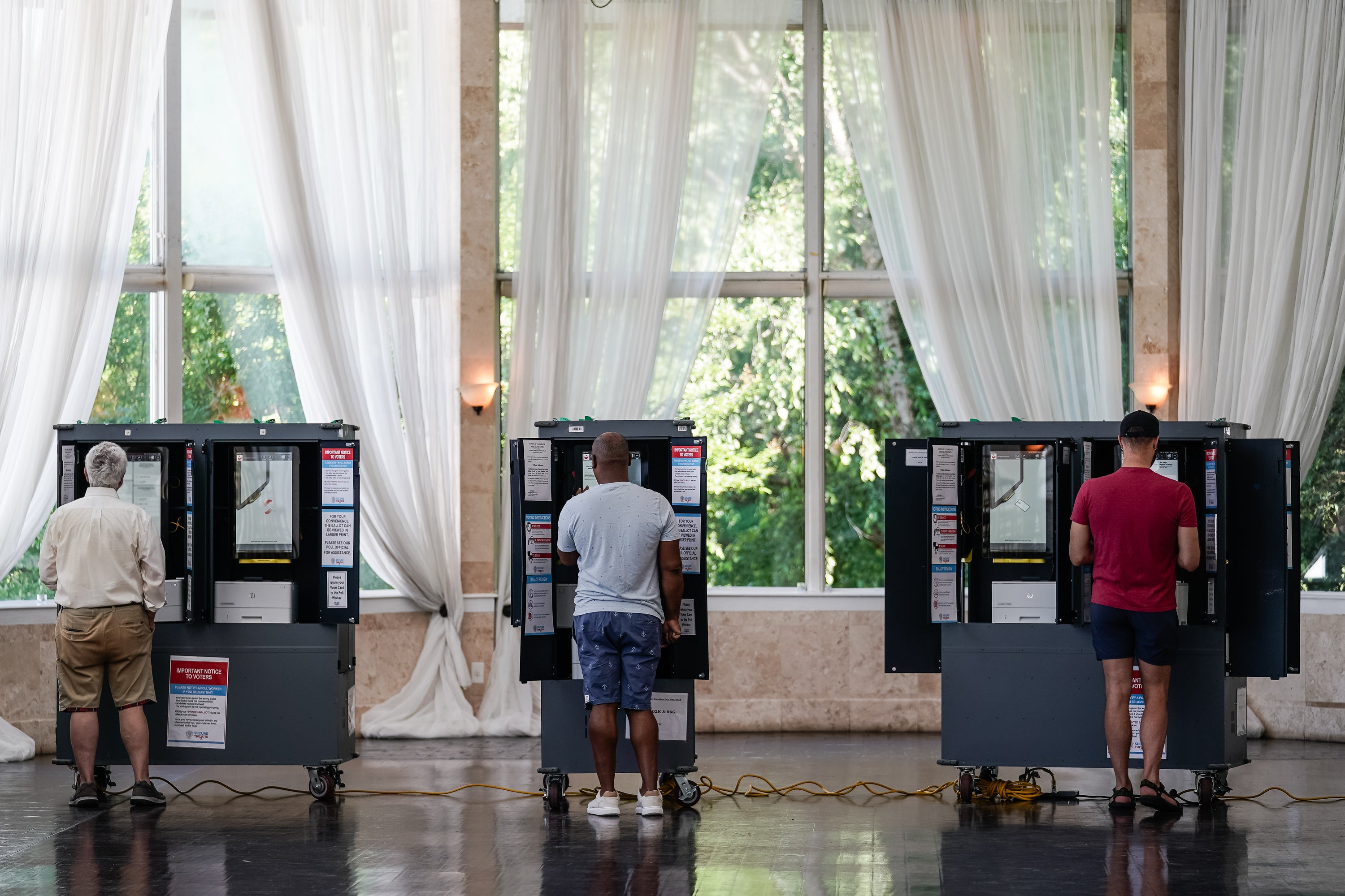 Voters cast ballots in Georgia's primary election at a polling location on May 21, 2024 in Atlanta, Georgia. The state’s election board has approved a controversial new measure