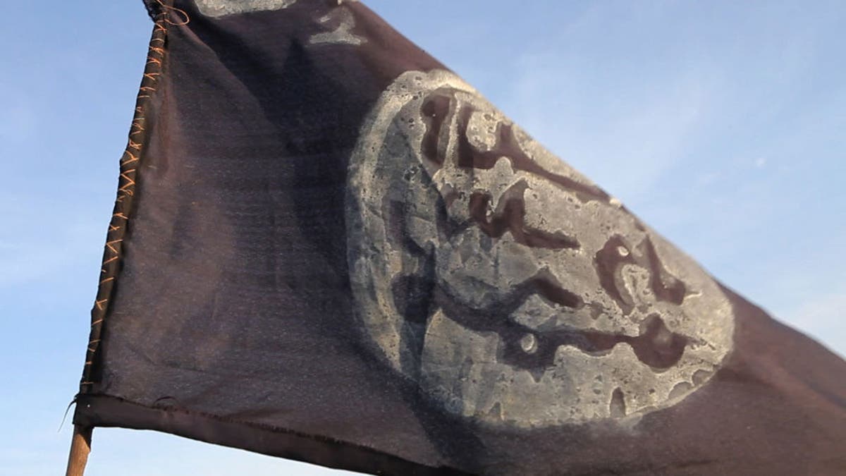 A Boko Haram flag flutters from an abandoned command post in Gamboru deserted after Chadian troops chased them from the border town on Feb. 4, 2015.