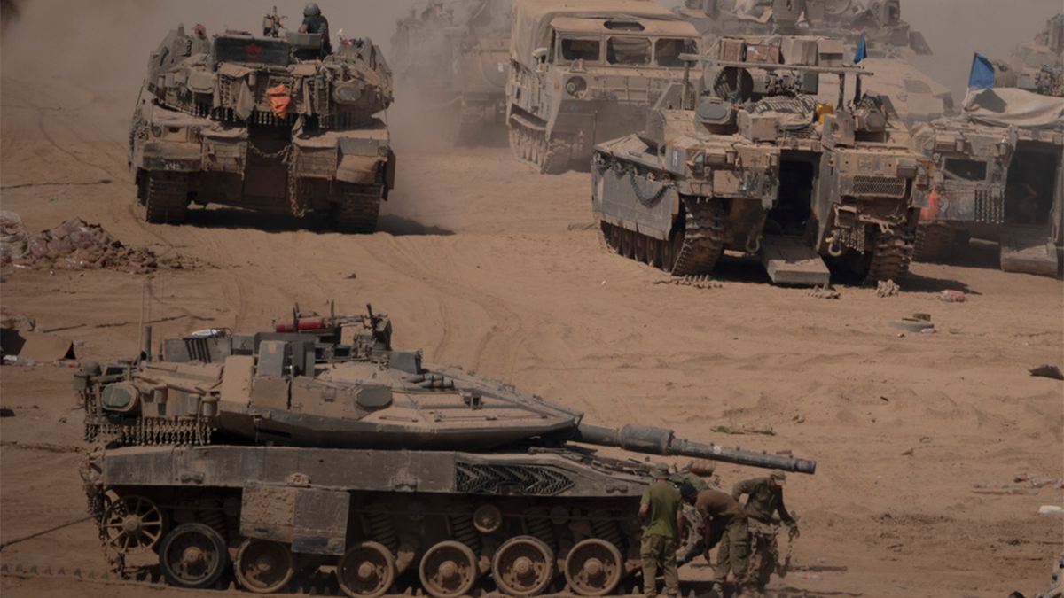 Israeli tanks are seen at a staging area near the Israeli-Gaza border in southern Israel on June 3, 2024.